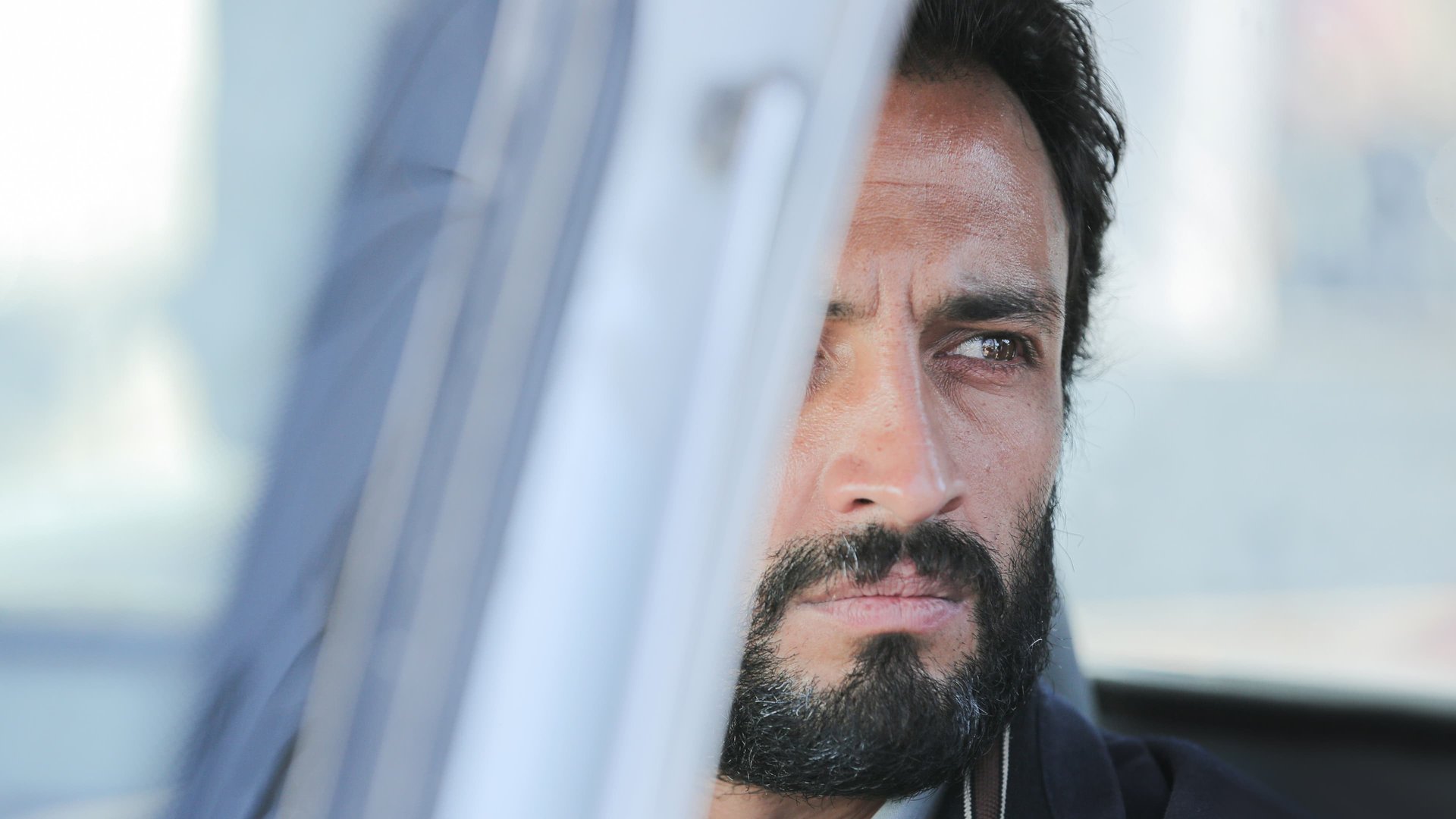 Cinematic background from A Hero 2021 - Rahim is in prison because of a debt he was unable to repay. During a two-day leave, he tries to convince his creditor to withdraw his complaint against the payment of part of the sum. But things don't go as planned. Is he truly a hero?