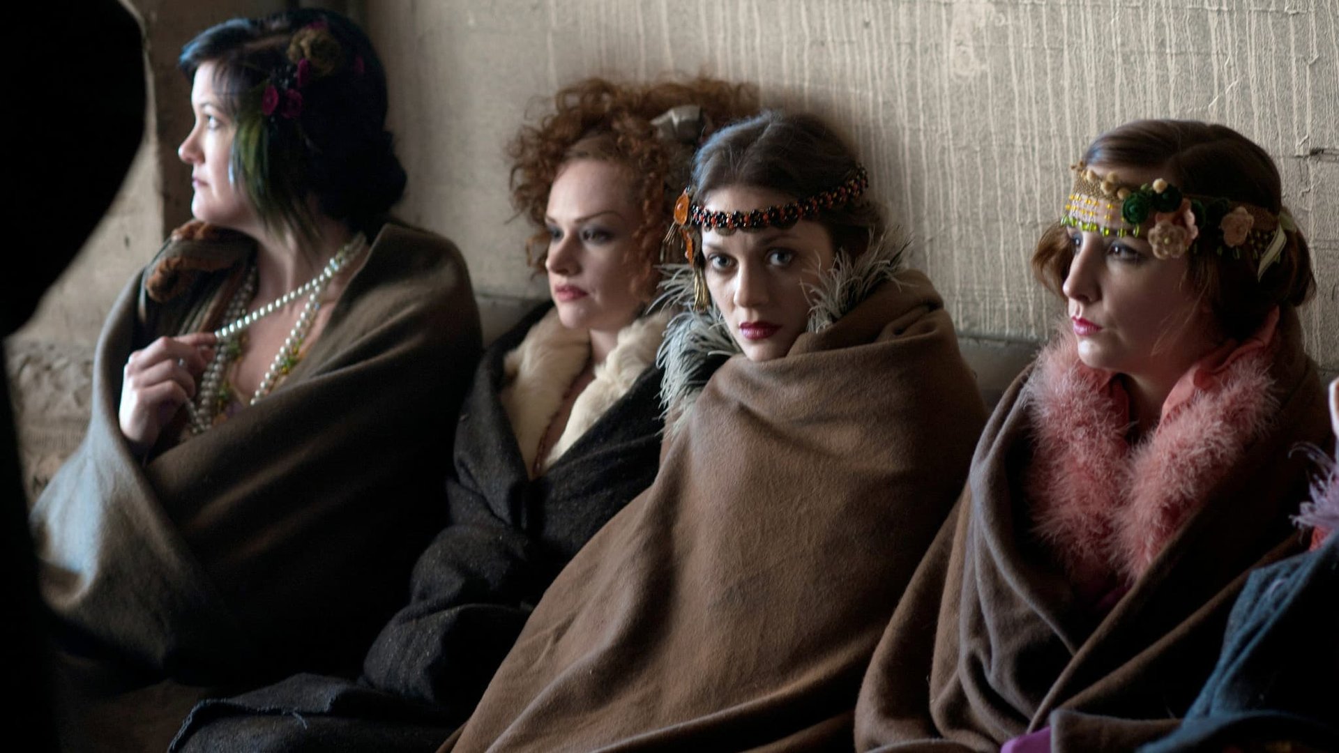 Cinematic background from The Immigrant 2013 - 1921 New York. An immigrant woman is tricked into a life of burlesque and vaudeville until a dazzling magician tries to save her and reunite her with her sister who is being held in the confines of Ellis Island.