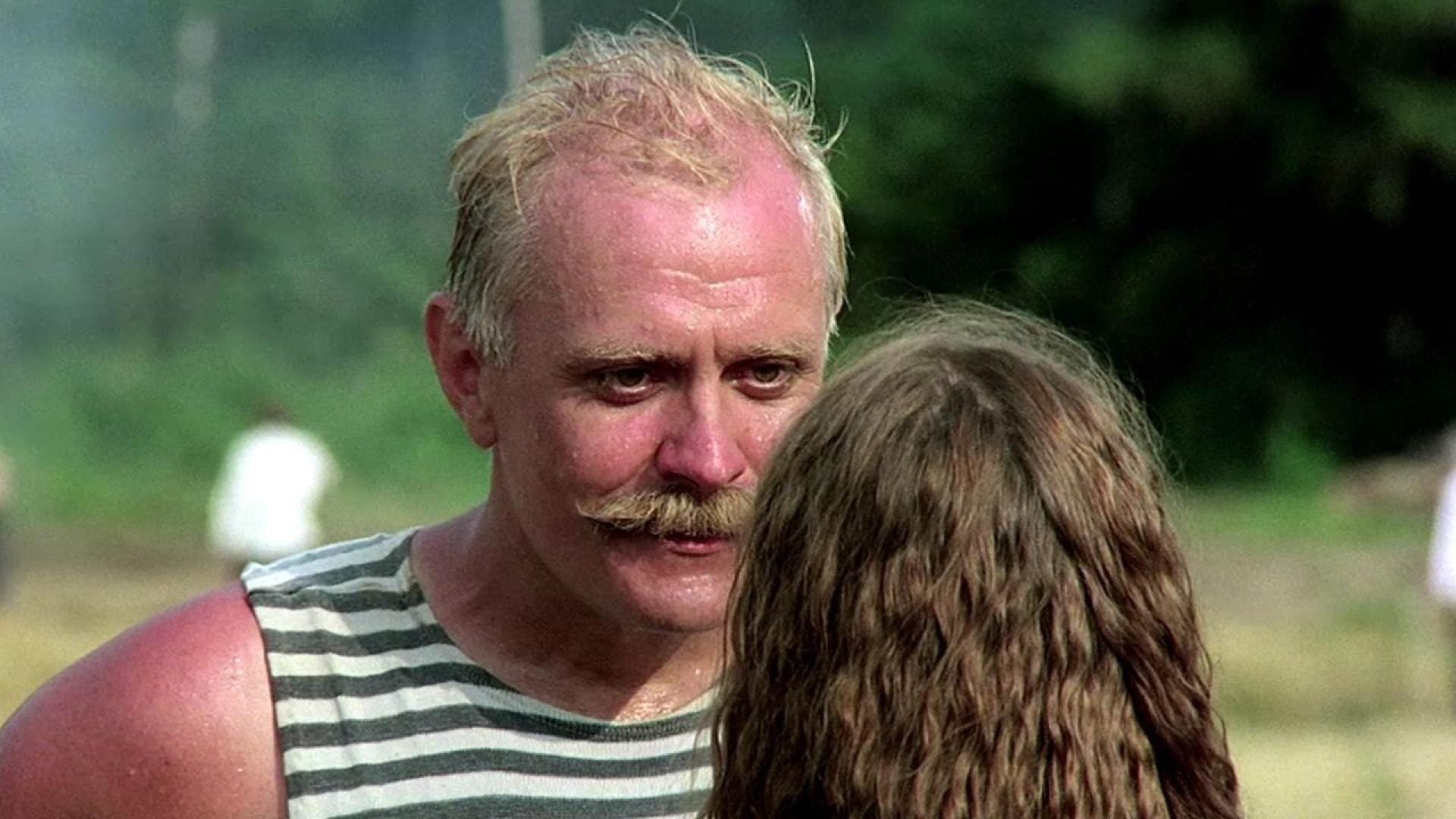 Cinematic background from Burnt by the Sun 1994 - Russia, 1936: revolutionary hero Colonel Kotov is spending an idyllic summer in his dacha with his young wife and six-year-old daughter Nadia and other assorted family and friends. Things change dramatically with the unheralded arrival of Cousin Dmitri from Moscow, who charms the women and little Nadia with his games and pianistic bravura. But Kotov isn't fooled: this is the time of Stalin's repression, with telephone calls in the middle of the night spelling doom - and he knows that Dmitri isn't paying a social call...