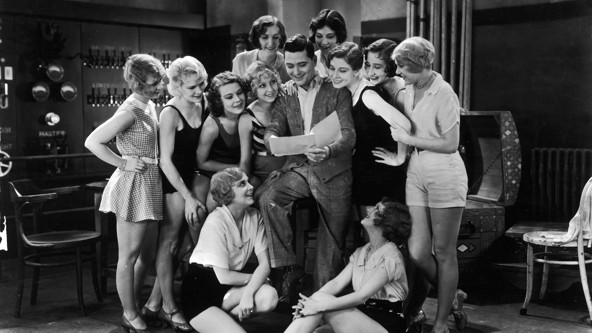 Cinematic background from The Broadway Melody 1929 - The vaudeville act of Harriet and Queenie Mahoney comes to Broadway, where their friend Eddie Kerns needs them for his number in one of Francis Zanfield's shows. When Eddie meets Queenie, he soon falls in love with  her—but she is already being courted by Jock Warriner, a member of New York high society. Queenie eventually recognizes that, to Jock, she is nothing more than a toy, and that Eddie is in love with her.