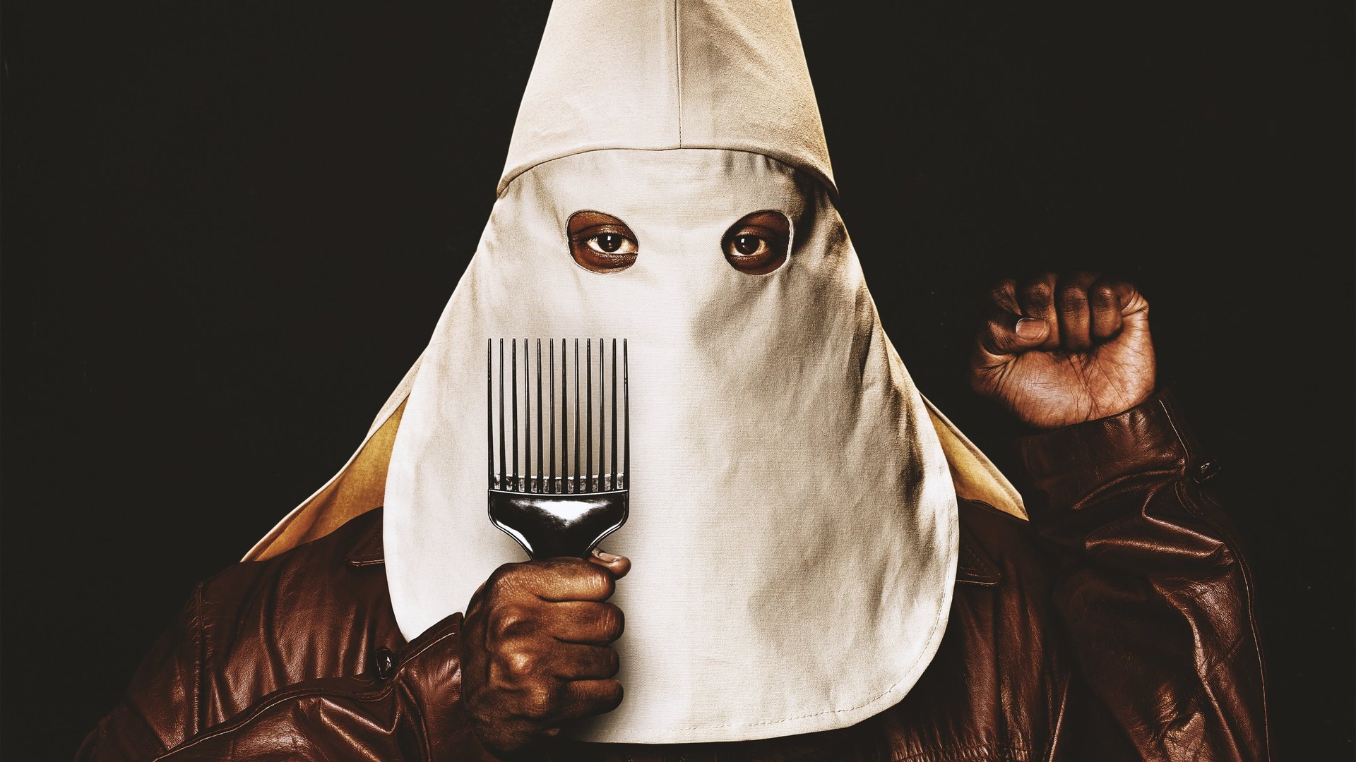 Cinematic background from BlacKkKlansman 2018 - Colorado Springs, late 1970s. Ron Stallworth, an African American police officer, and Flip Zimmerman, his Jewish colleague, run an undercover operation to infiltrate the Ku Klux Klan.