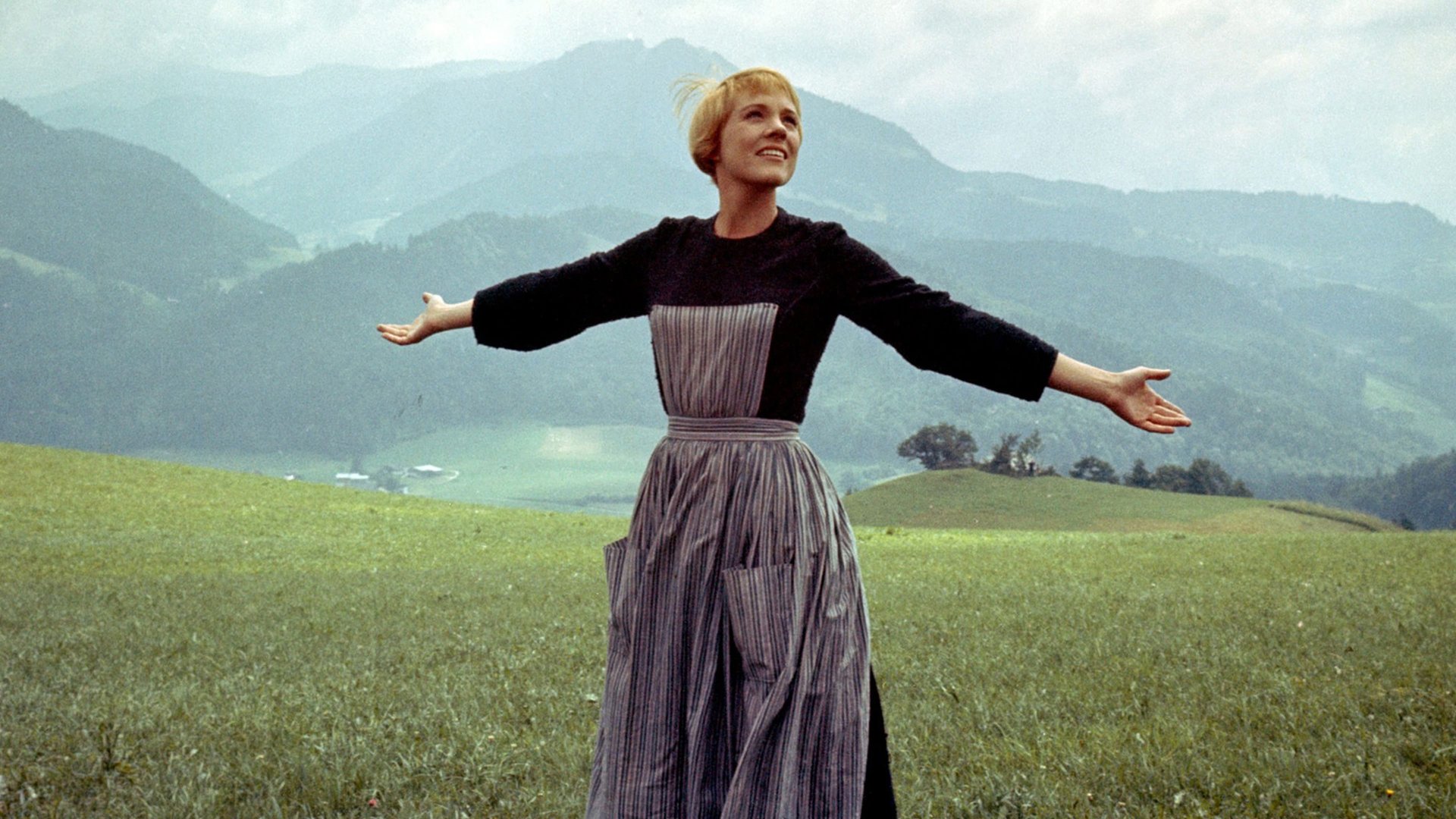 Cinematic background from The Sound of Music 1965 - In the years before the Second World War, a tomboyish postulant at an Austrian abbey is hired as a governess in the home of a widowed naval captain with seven children, and brings a new love of life and music into the home.