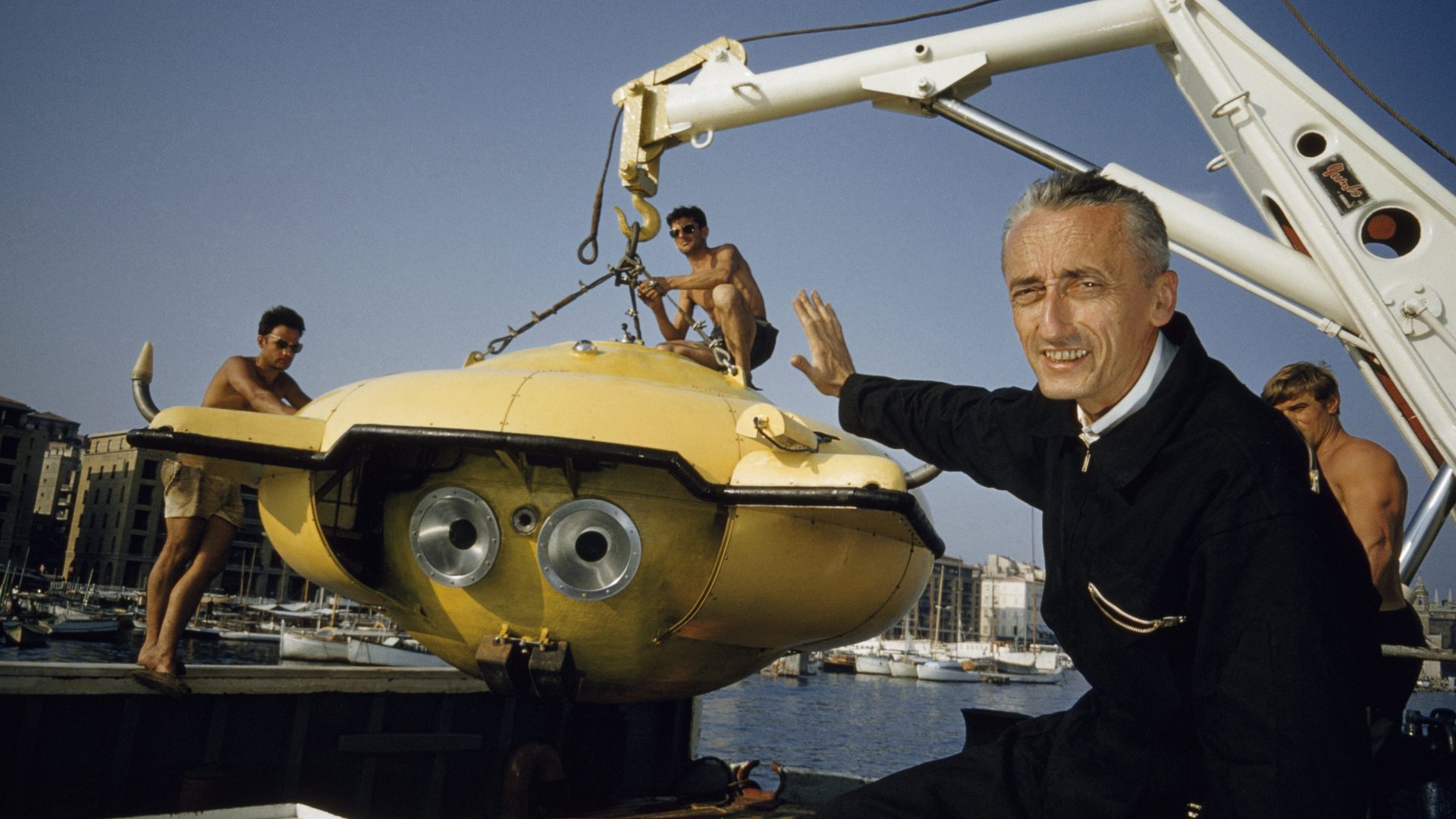 Cinematic background from Becoming Cousteau 2021 - Adventurer, filmmaker, inventor, author, unlikely celebrity and conservationist: For over four decades, Jacques-Yves Cousteau and his explorations under the ocean became synonymous with a love of science and the natural world. As he learned to protect the environment, he brought the whole world with him, sounding alarms more than 50 years ago about the warming seas and our planet’s vulnerability. In BECOMING COUSTEAU, from National Geographic Documentary Films, two-time Academy Award®-nominated filmmaker Liz Garbus takes an inside look at Cousteau and his life, his iconic films and inventions, and the experiences that made him the 20th century’s most unique and renowned environmental voice — and the man who inspired generations to protect the Earth.