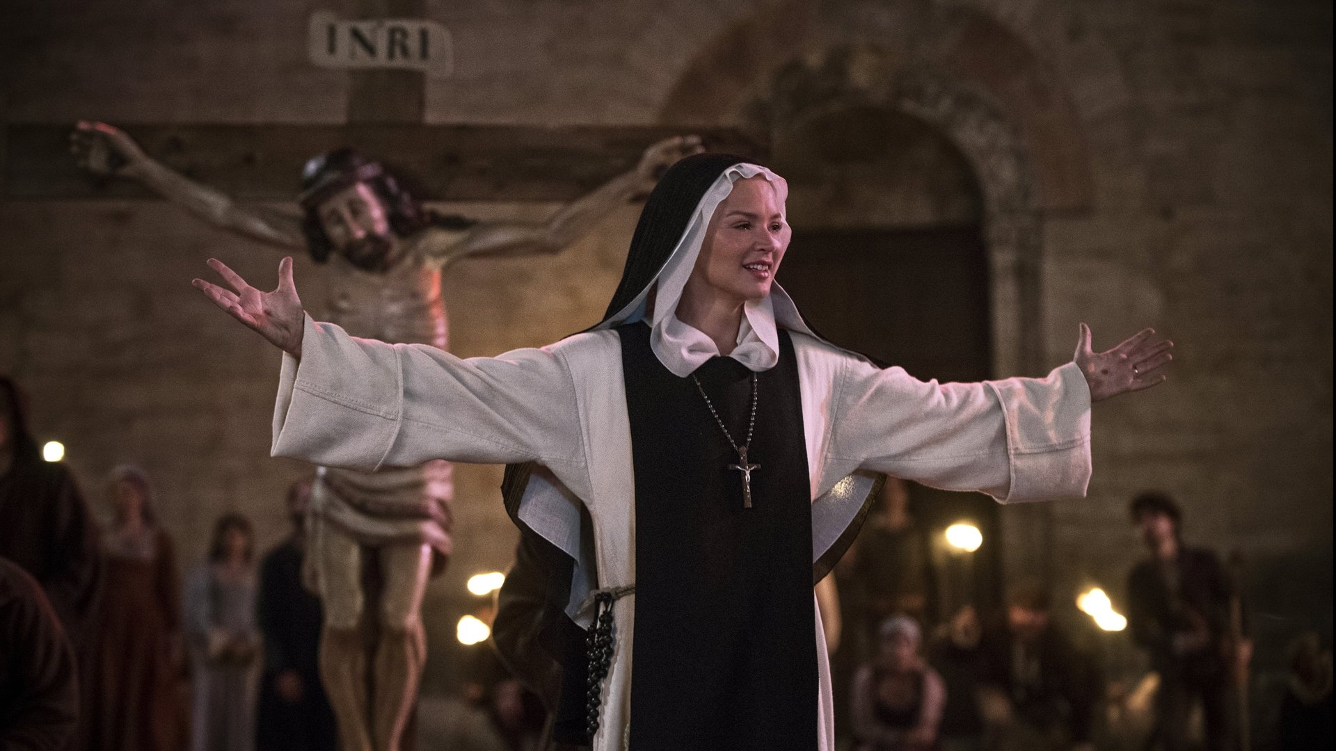 Cinematic background from Benedetta 2021 - A 17th-century nun becomes entangled in a forbidden lesbian affair with a novice. But it is Benedetta's shocking religious visions that threaten to shake the Church to its core.