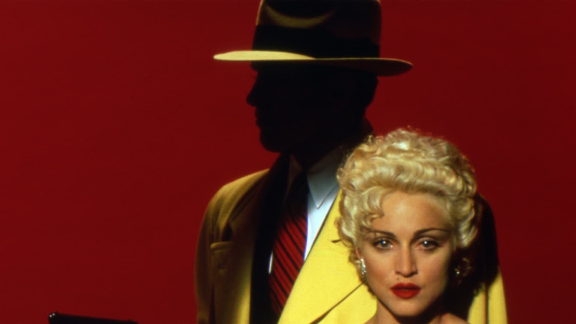 Cinematic background from Dick Tracy 1990 - The comic strip detective finds his life vastly complicated when Breathless Mahoney makes advances towards him while he is trying to battle Big Boy Caprice's united mob.