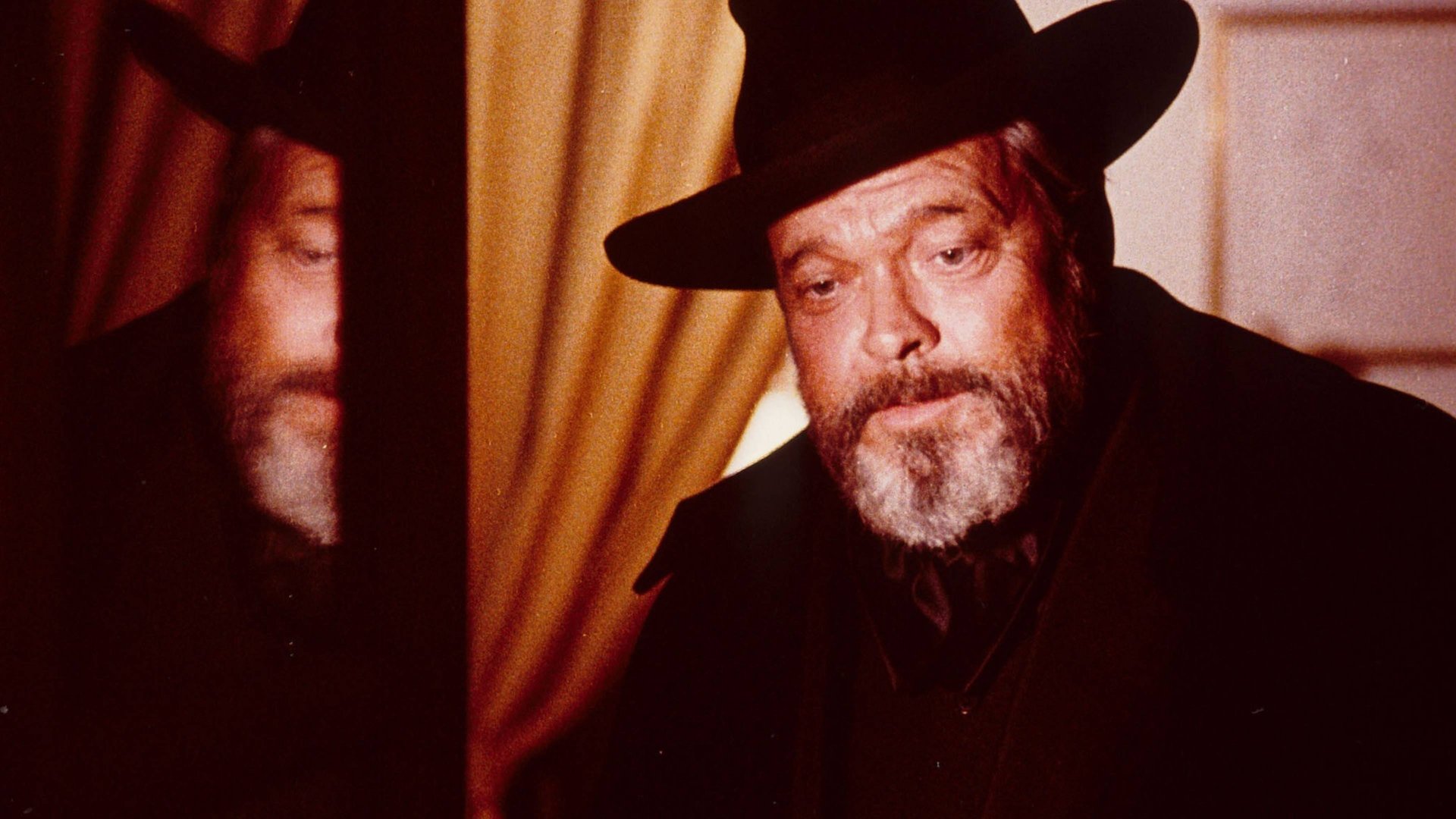 Cinematic background from F for Fake 1973 - Documents the lives of infamous fakers Elmyr de Hory and Clifford Irving. De Hory, who later committed suicide to avoid more prison time, made his name by selling forged works of art by painters like Picasso and Matisse. Irving was infamous for writing a fake autobiography of Howard Hughes. Welles moves between documentary and fiction as he examines the fundamental elements of fraud and the people who commit fraud at the expense of others.