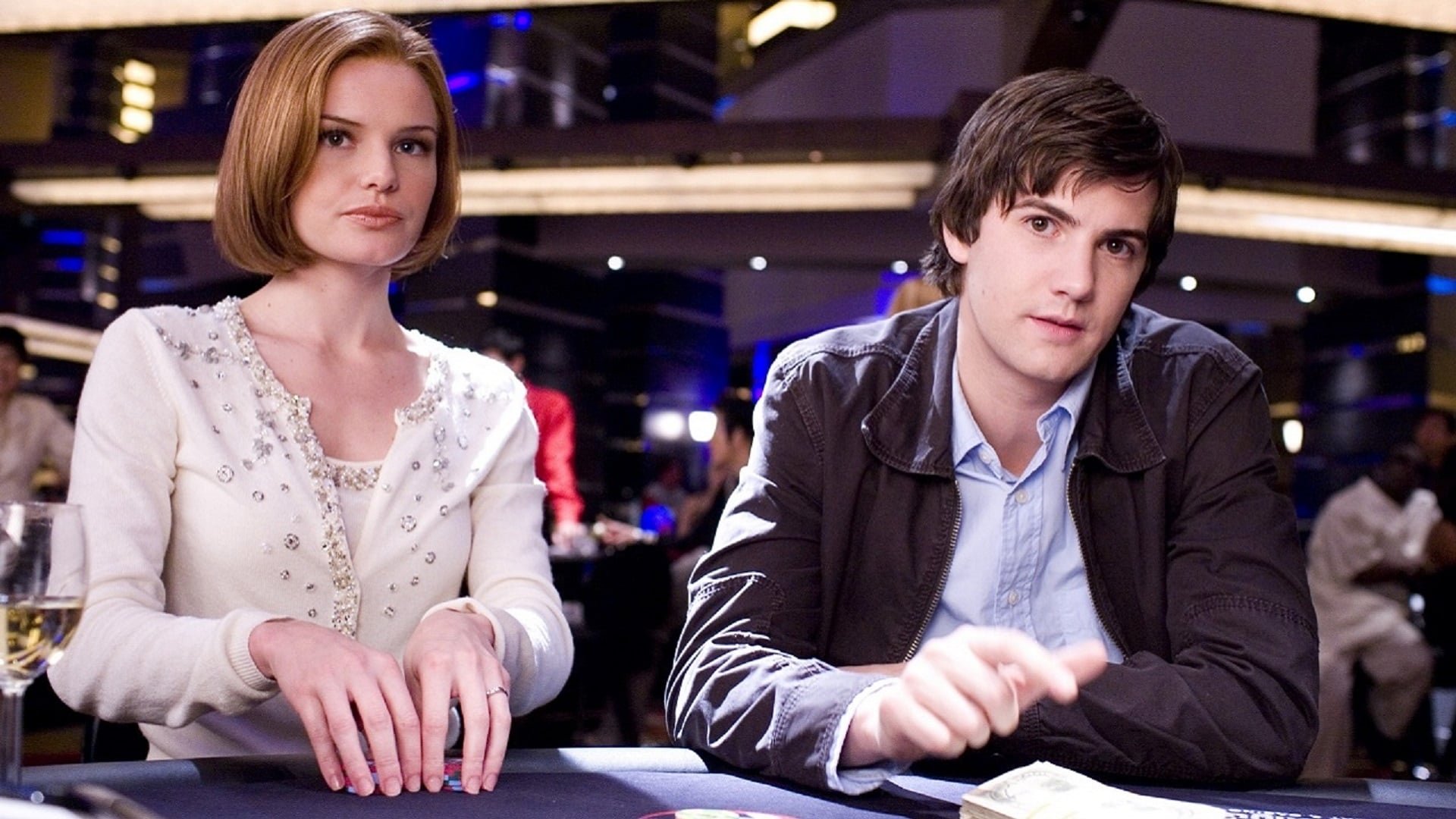 Cinematic background from 21 2008 - Ben Campbell is a young, highly intelligent student at M.I.T. who strives to succeed. Wanting a scholarship to transfer to Harvard School of Medicine to become a doctor, Ben learns that he cannot afford the $300,000 tuition as he comes from a poor, working-class background. But one evening, Ben is introduced by his unorthodox math professor to a small but secretive club of five students, Jill, Choi, Kianna, and Fisher, who are being trained by Professor Rosa to count cards at blackjack.