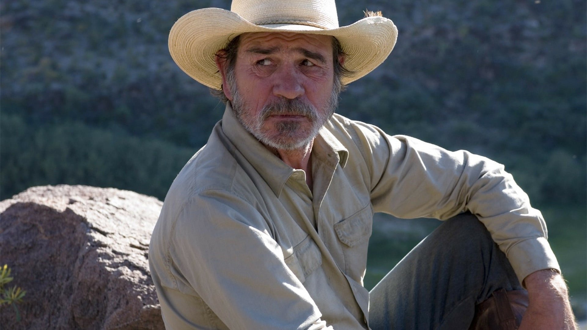 Cinematic background from The Three Burials of Melquiades Estrada 2005 - When brash Texas border officer Mike Norton wrongfully kills and buries the friend and ranch hand of Pete Perkins, the latter is reminded of a promise he made to bury his friend, Melquiades Estrada, in his Mexican home town. He kidnaps Norton and exhumes Estrada's corpse, and the odd caravan sets out on horseback for Mexico.