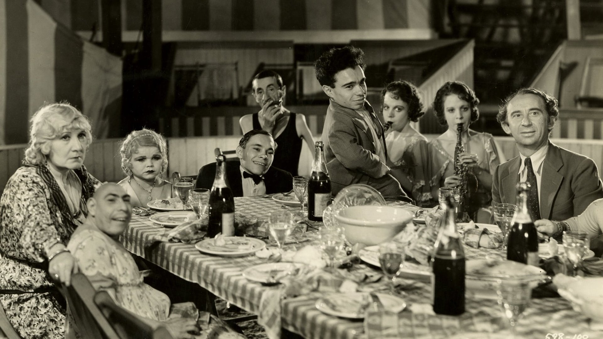 Cinematic background from Freaks 1932 - A circus' beautiful trapeze artist agrees to marry the leader of side-show performers, but his deformed friends discover she is only marrying him for his inheritance.
