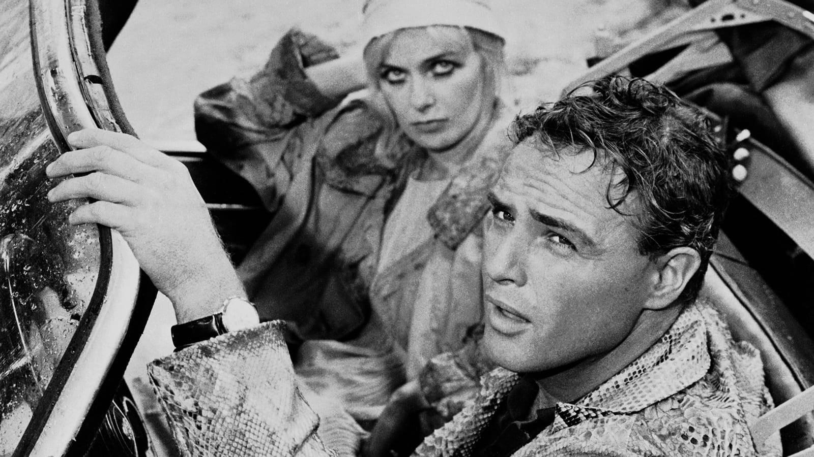 Cinematic background from The Fugitive Kind 1960 - Val Xavier, a drifter of obscure origins, arrives at a small town and gets a job in a store run by Lady Torrence. Her husband, Jabe M. Torrance, is dying of cancer. Val is pursued by Carol Cutere, the enigmatic local tramp-of-good-family.