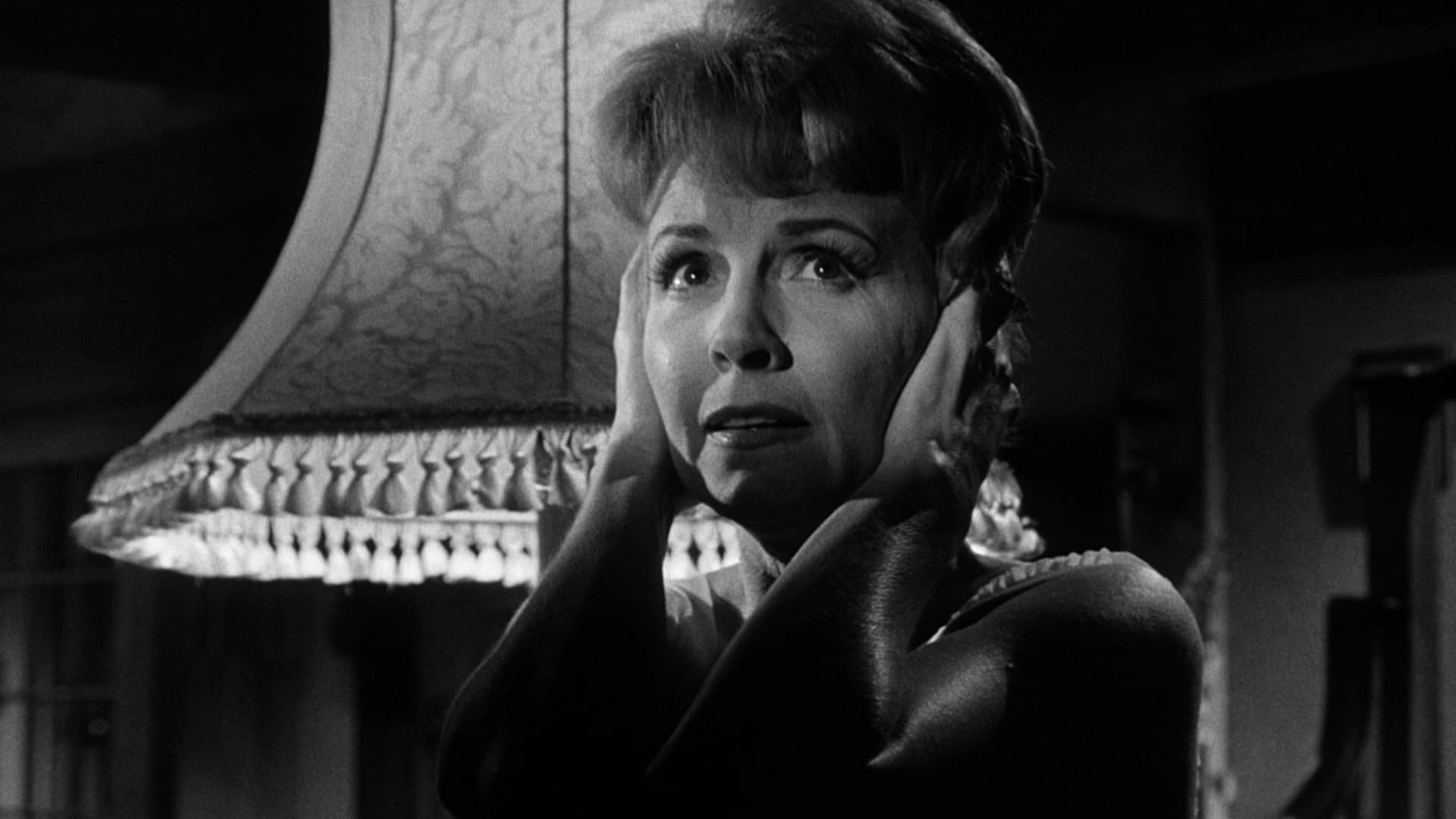 Cinematic background from Night of the Eagle 1962 - A skeptical college professor discovers that his wife has been practicing magic for years. Like the learned, rational fellow he is, he forces her to destroy all her magical charms and protective devices, and stop that foolishness. He isn't put off by her insistence that his professional rivals are working magic against him, and her protections are necessary to his career and life.