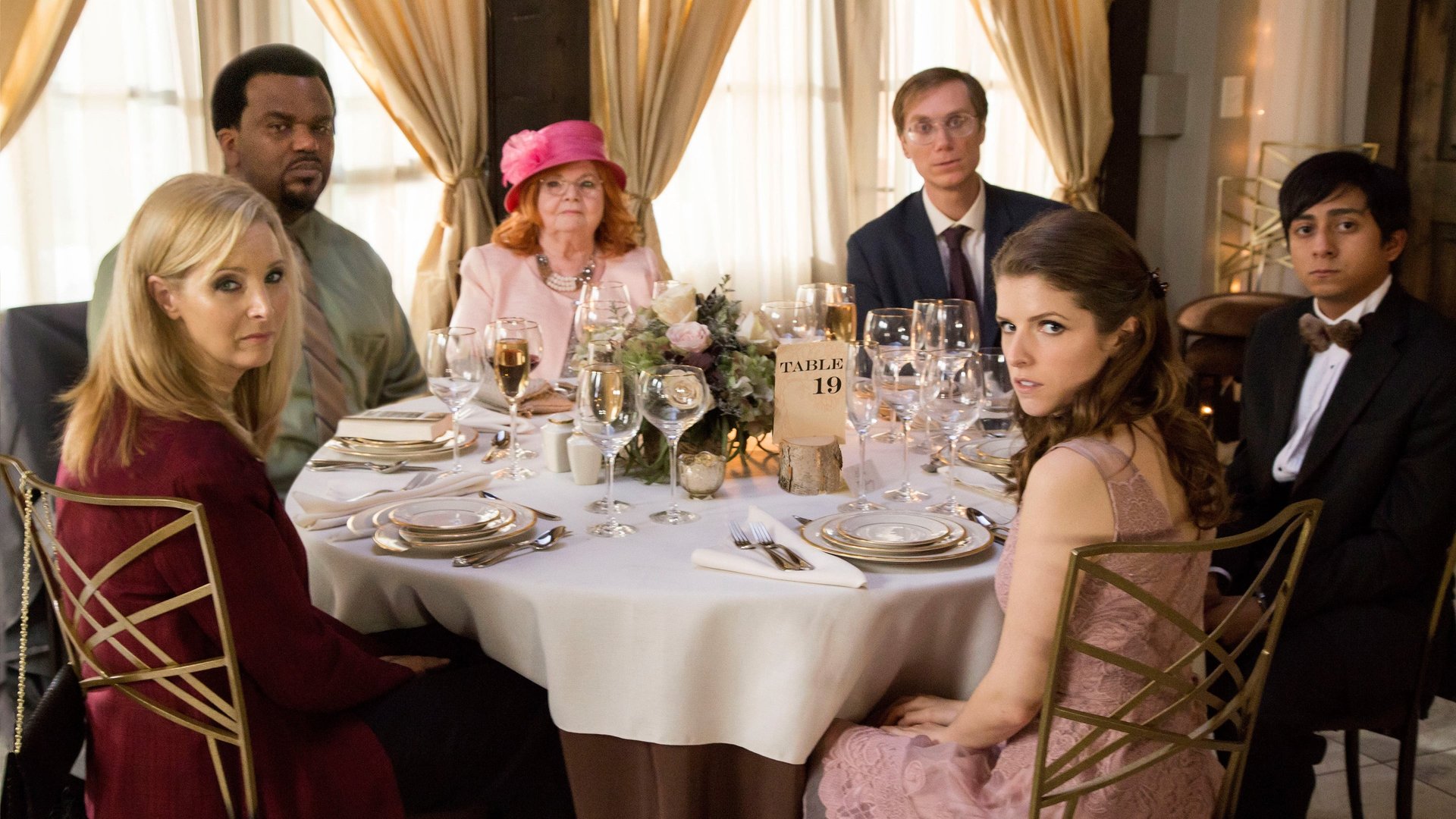 Cinematic background from Table 19 2017 - Eloise, having been relieved of maid of honor duties after being unceremoniously dumped by the best man via text, decides to attend the wedding anyway – only to find herself seated with five fellow-unwanted guests at the dreaded Table 19.