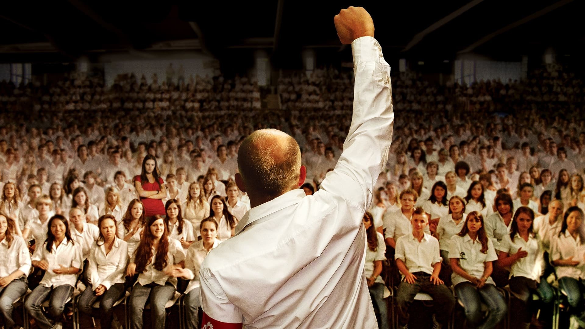 Cinematic background from The Wave 2008 - A school teacher discusses types of government with his class. His students find it too boring to repeatedly go over national socialism and believe that dictatorship cannot be established in modern Germany. He starts an experiment to show how easily the masses can become manipulated.
