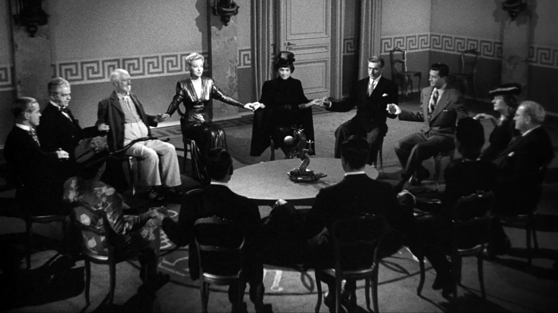 Cinematic background from Ministry of Fear 1944 - Stephen Neale is released into WWII England after two years in an asylum, but it doesn't seem so sane outside either. On his way back to London to rejoin civilization, he stumbles across a murderous spy ring and doesn't quite know  to whom to turn.