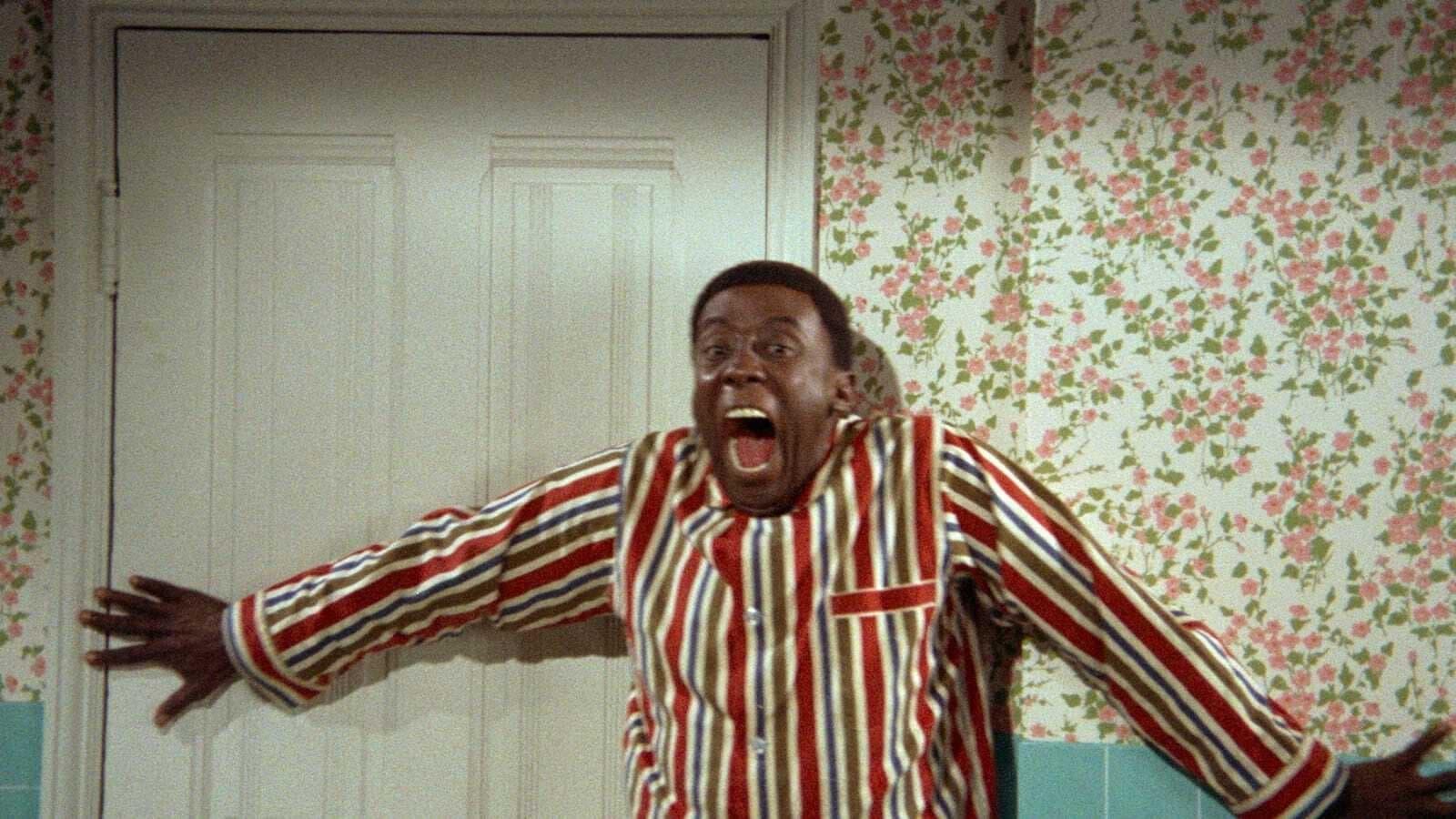 Cinematic background from Watermelon Man 1970 - Jeff Gerber, a racist insurance agent and fitness freak, lives in a typical suburban neighborhood. But Jeff's bigoted world of taunting and harassing black people on and off the job is turned upside down when his skin inexplicably turns dark overnight. As Jeff tries to come to terms with this unexplained phenomenon that has befallen him, he soon becomes the victim himself, when all of his friends and neighbors suddenly shun and harass him.