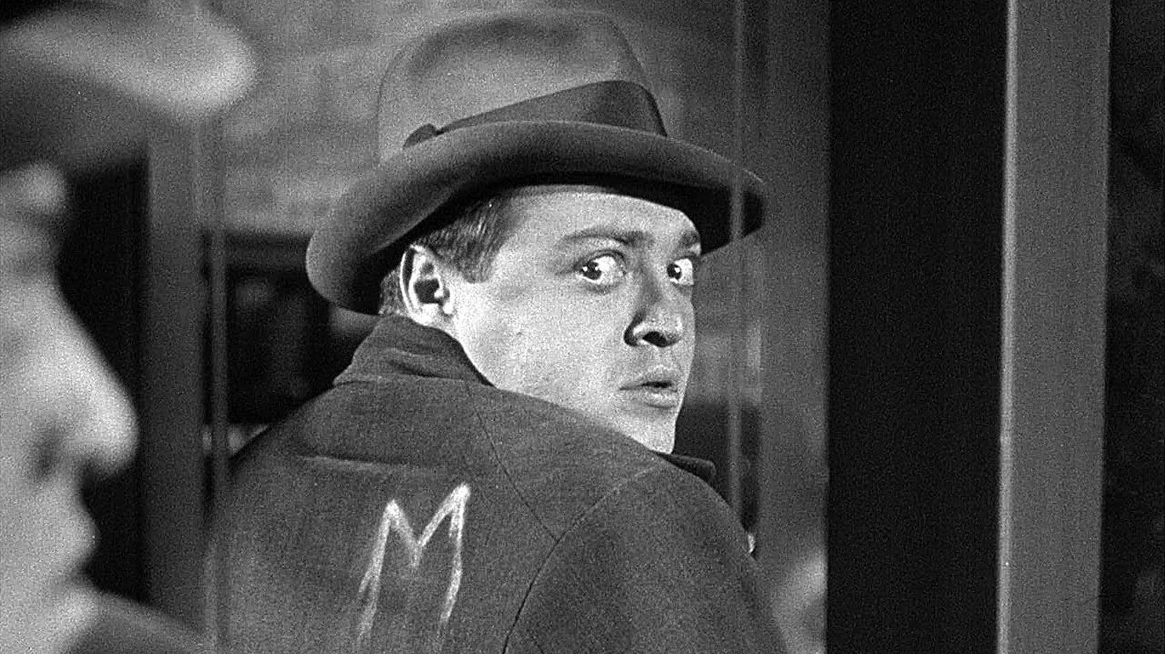 Cinematic background from M 1931 - In this classic German thriller, Hans Beckert, a serial killer who preys on children, becomes the focus of a massive Berlin police manhunt. Beckert's heinous crimes are so repellant and disruptive to city life that he is even targeted by others in the seedy underworld network. With both cops and criminals in pursuit, the murderer soon realizes that people are on his trail, sending him into a tense, panicked attempt to escape justice.