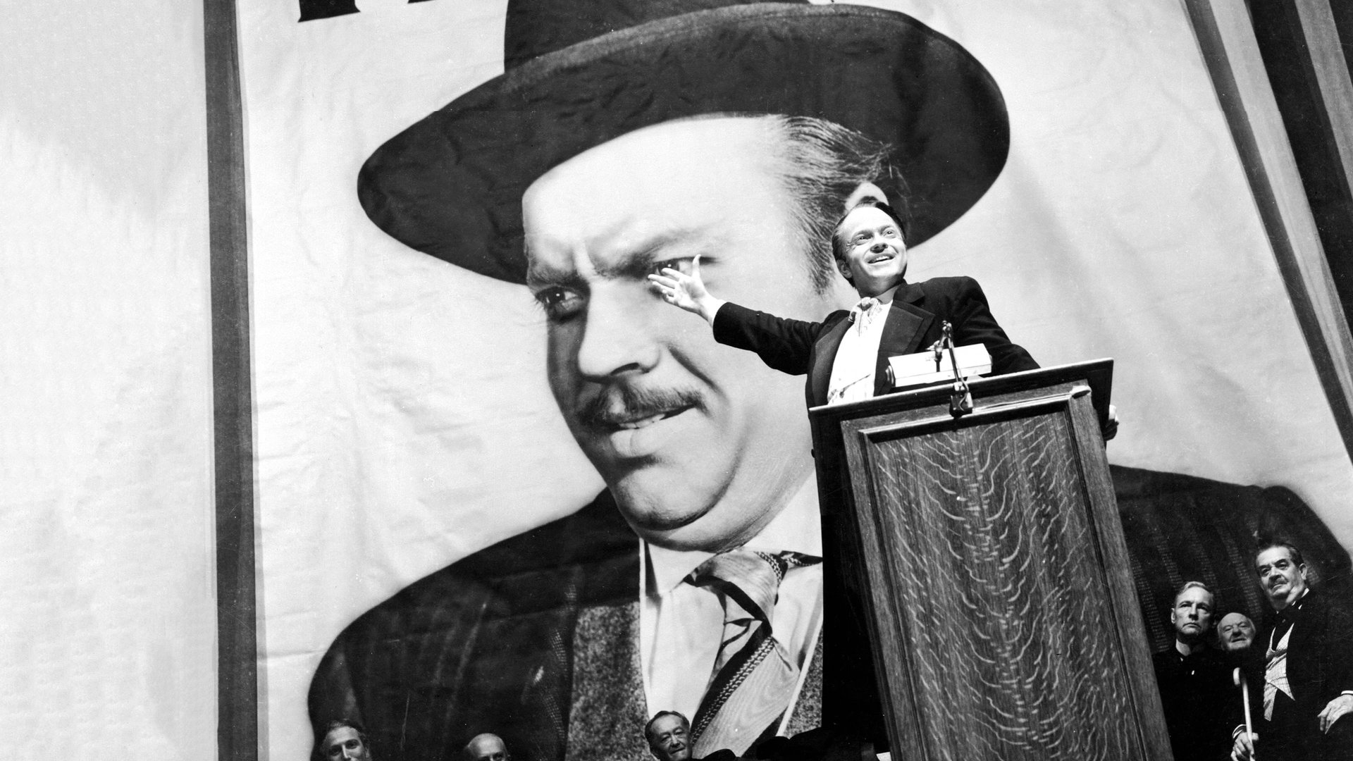 Cinematic background from Citizen Kane 1941 - Newspaper magnate, Charles Foster Kane is taken from his mother as a boy and made the ward of a rich industrialist. As a result, every well-meaning, tyrannical or self-destructive move he makes for the rest of his life appears in some way to be a reaction to that deeply wounding event.