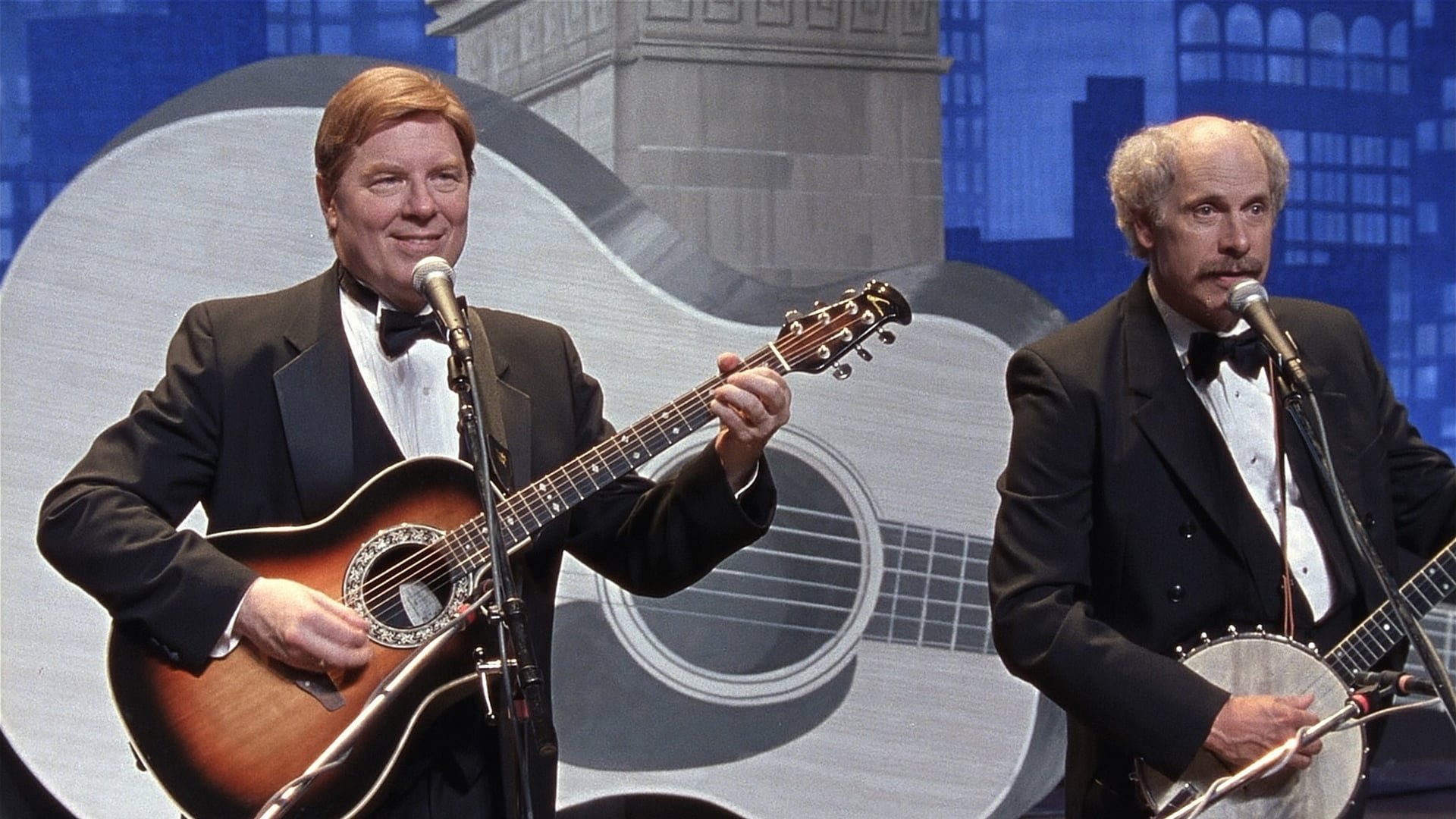 Cinematic background from A Mighty Wind 2003 - Director Christopher Guest reunites the team from "Best In Show" and "Waiting for Guffman" to tell the story of '60s-era folk musicians, who, inspired by the death of their former manager, get back on the stage for one concert in New York City's Town Hall.