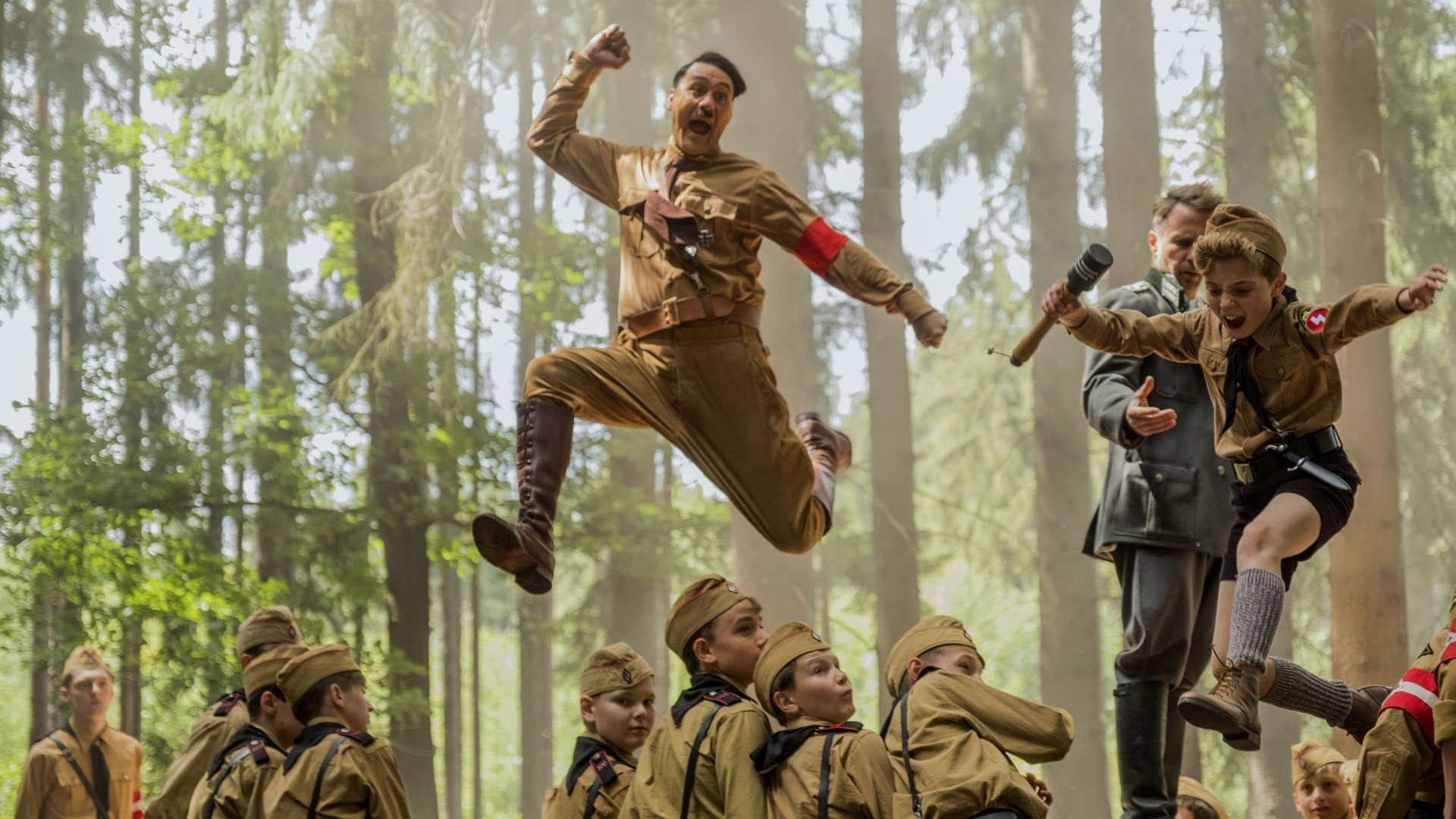 Cinematic background from Jojo Rabbit 2019 - A World War II satire that follows a lonely German boy whose world view is turned upside down when he discovers his single mother is hiding a young Jewish girl in their attic. Aided only by his idiotic imaginary friend, Adolf Hitler, Jojo must confront his blind nationalism.