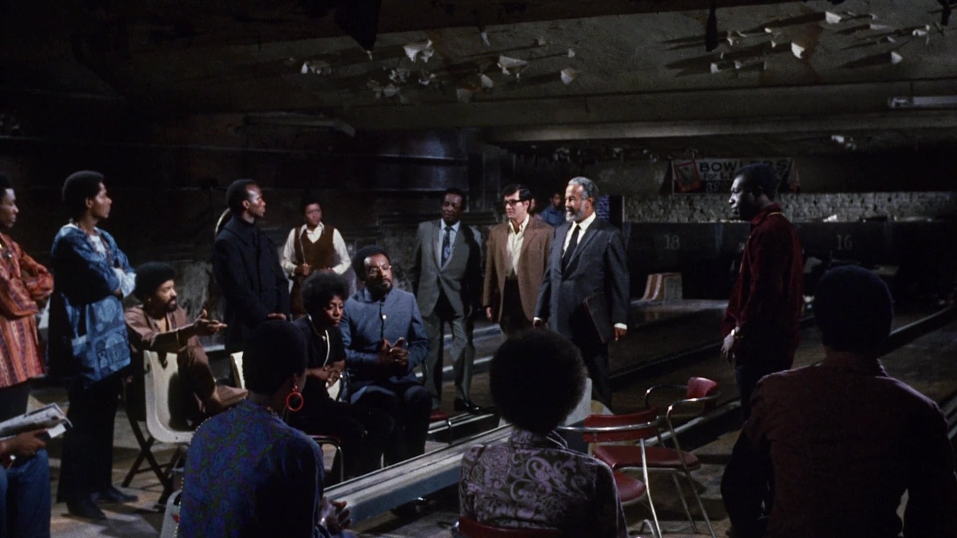 Cinematic background from Uptight 1968 - Black militants building up an arsenal of weapons in preparation for a race war are betrayed by one of their own.