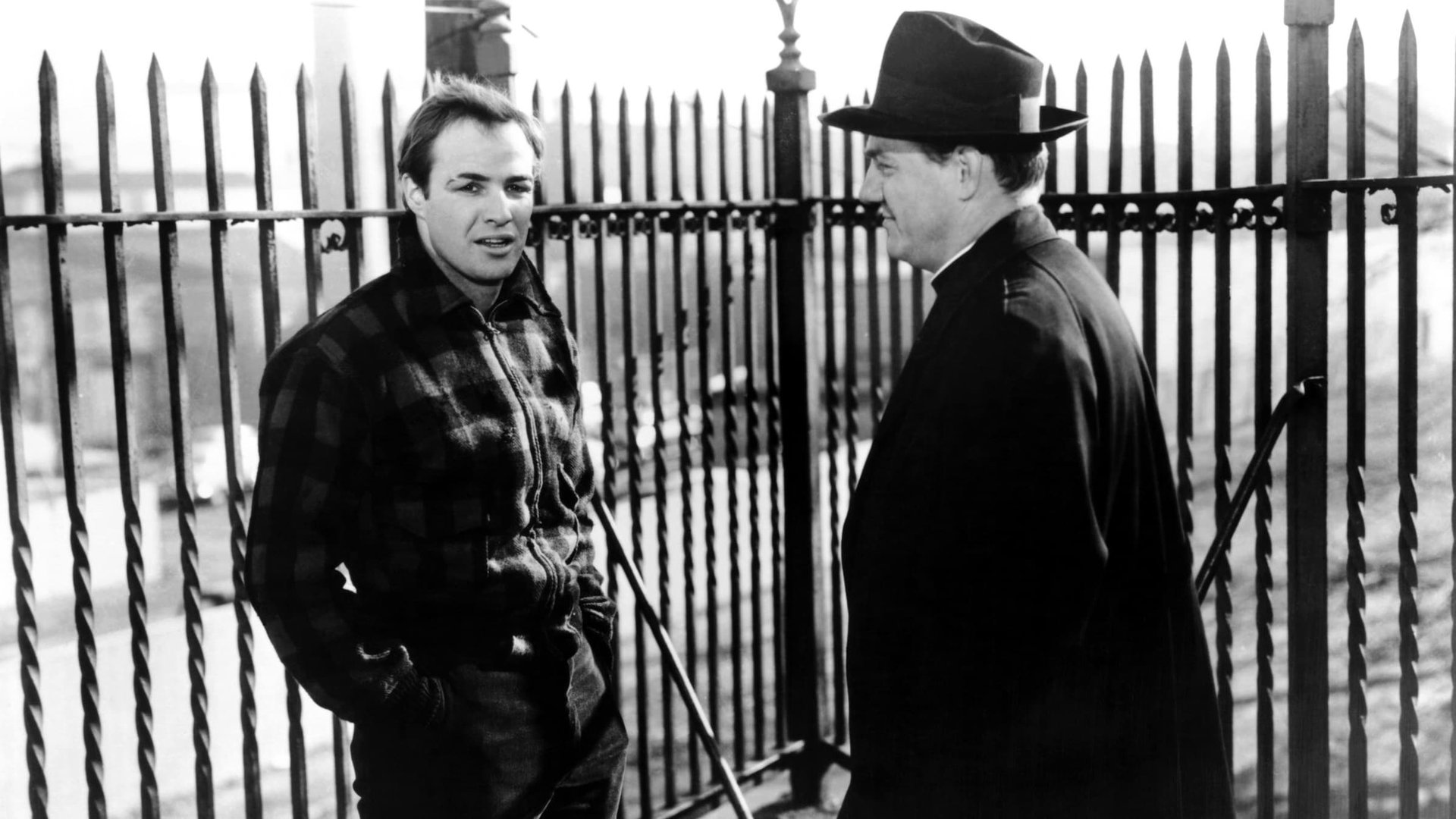 Cinematic background from On the Waterfront 1954 - A dim-witted yet kind-hearted boxer, Terry Malloy, who failed to succeed unintentionally lures a man to his death after being tricked by a criminal called Johnny Friendly whose men pick of every man who has the courage to speak up to their crimes. As he works on the waterfronts that Friendly owns, he is sent to a church meeting run by a good preacher about how to deal with the problem and runs into the dead man’s sister. Slowly, he falls in love with her and begins to feel guilt about his crime.
