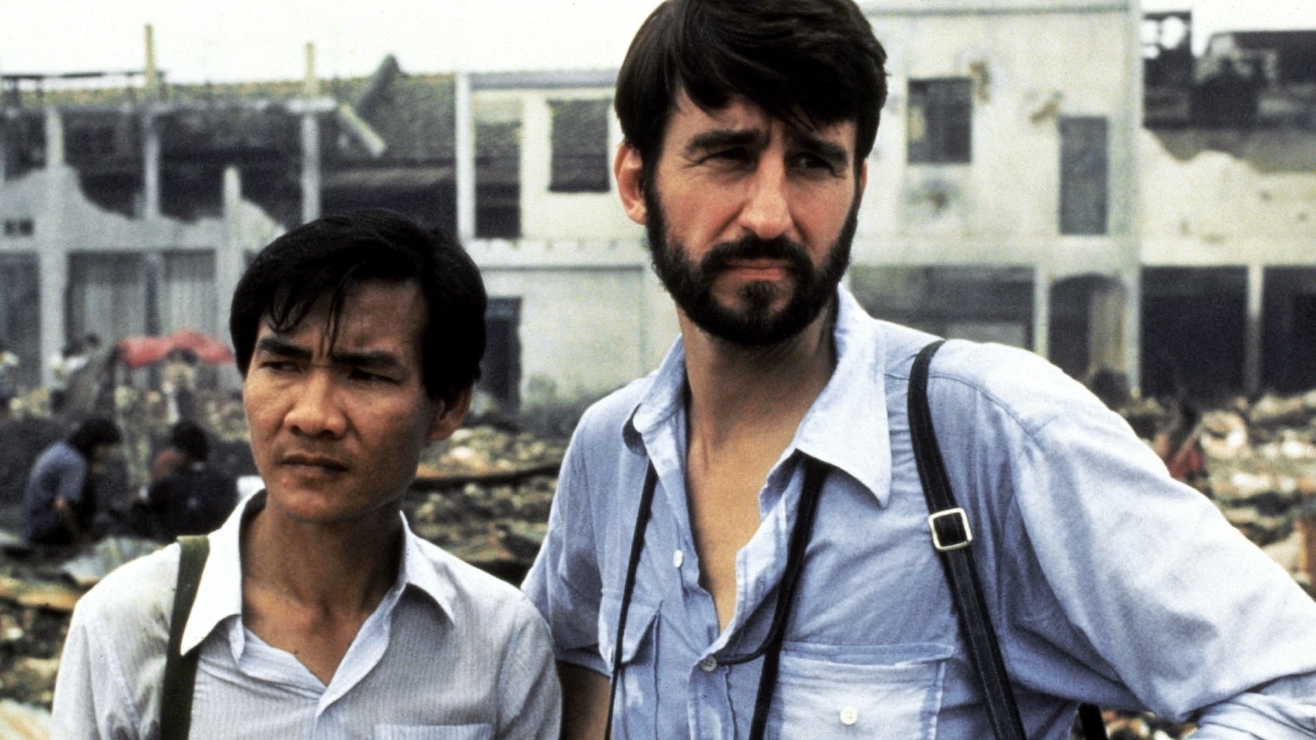 Cinematic background from The Killing Fields 1984 - New York Times reporter Sydney Schanberg is on assignment covering the Cambodian Civil War, with the help of local interpreter Dith Pran and American photojournalist Al Rockoff. When the U.S. Army pulls out amid escalating violence, Schanberg makes exit arrangements for Pran and his family. Pran, however, tells Schanberg he intends to stay in Cambodia to help cover the unfolding story — a decision he may regret as the Khmer Rouge rebels move in.