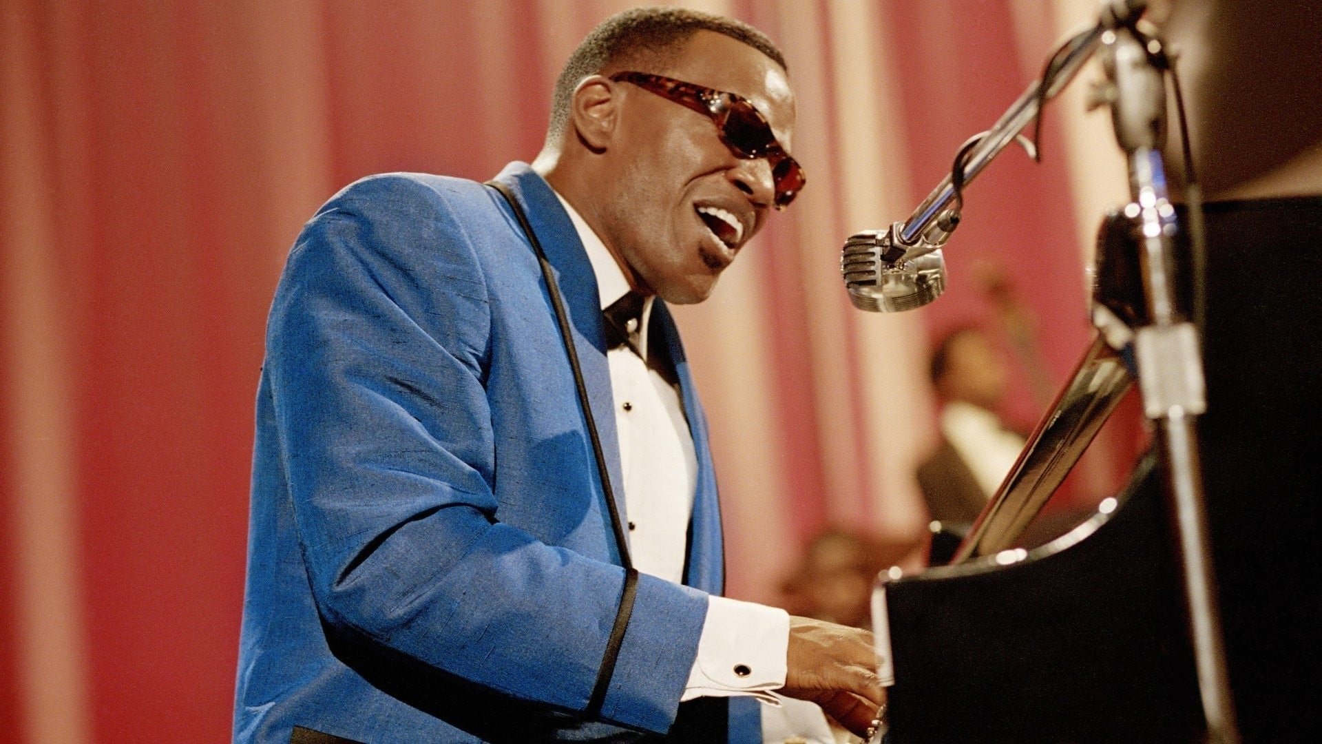 Cinematic background from Ray 2004 - Born on a sharecropping plantation in Northern Florida, Ray Charles went blind at seven. Inspired by a fiercely independent mom who insisted he make his own way, He found his calling and his gift behind a piano keyboard. Touring across the Southern musical circuit, the soulful singer gained a reputation and then exploded with worldwide fame when he pioneered coupling gospel and country together.