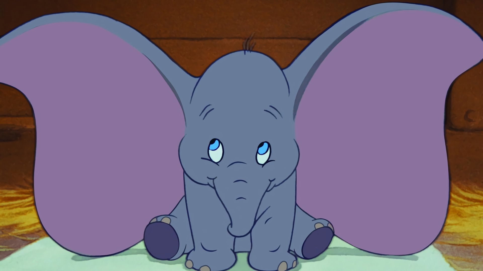 Cinematic background from Dumbo 1941 - Dumbo is a baby elephant born with over-sized ears and a supreme lack of confidence. But thanks to his even more diminutive buddy Timothy the Mouse,  the pint-sized pachyderm learns to surmount all obstacles.