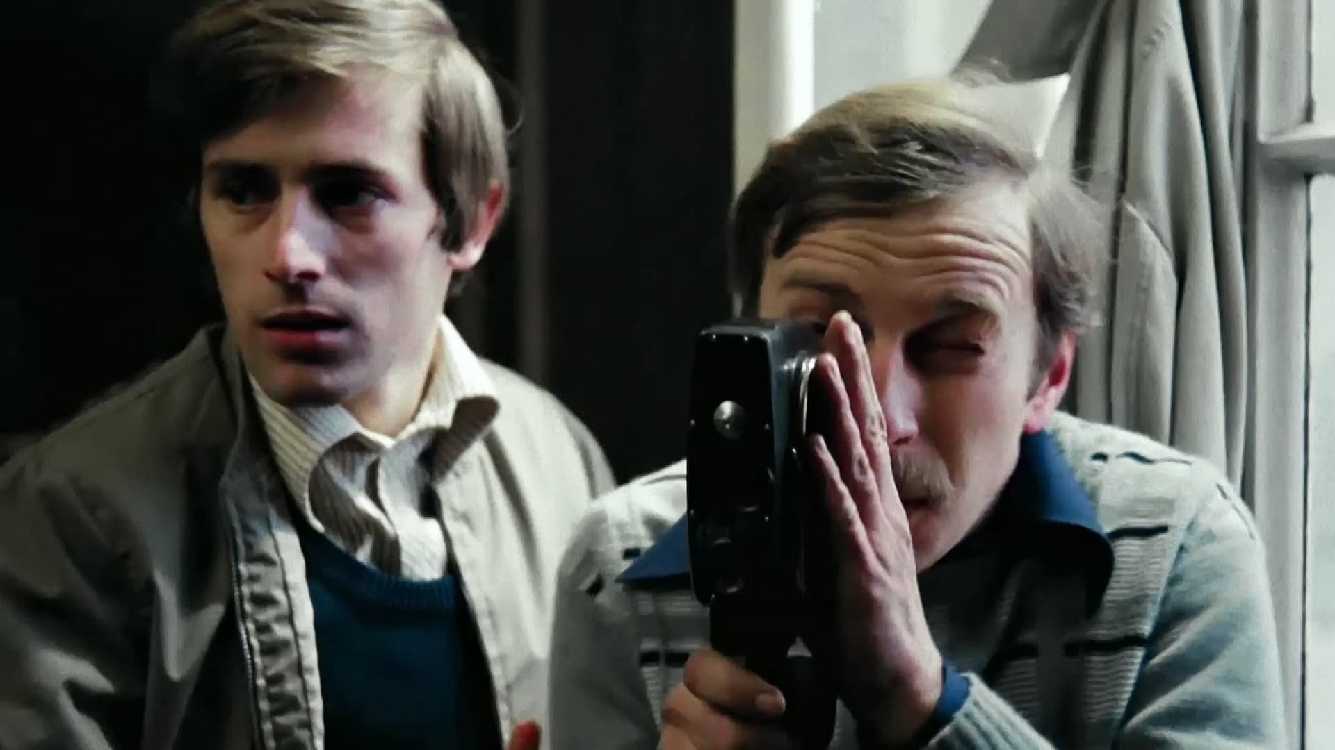 Cinematic background from Camera Buff 1979 - Filip buys an 8mm movie camera when his first child is born. Because it's the first camera in town, he's named official photographer by the local Party boss. His horizons widen when he is sent to regional film festivals with his first works but his focus on movie making also leads to domestic strife and philosophical dilemmas.