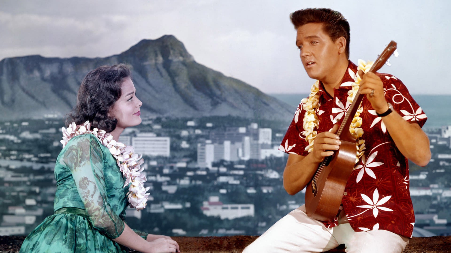 Cinematic background from Blue Hawaii 1961 - Chad Gates has just been discharged from the Army, and is happy to be back in Hawaii with his surf-board, his beach buddies and his girlfriend.