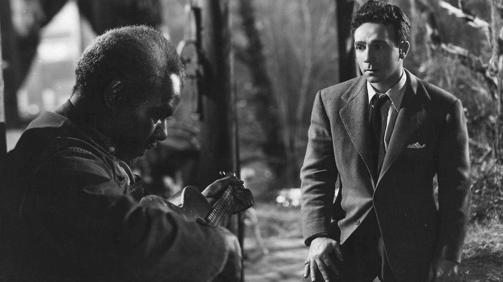Cinematic background from Moonrise 1948 - Stigmatized from infancy by the fate of his criminal father, a man is bruised and bullied until one night, in a fit of rage, he kills his most persistent tormentor. As the police close in around him, he makes a desperate bid for the love of the dead man’s fiancée, a schoolteacher who sees the wounded soul behind his aggression.