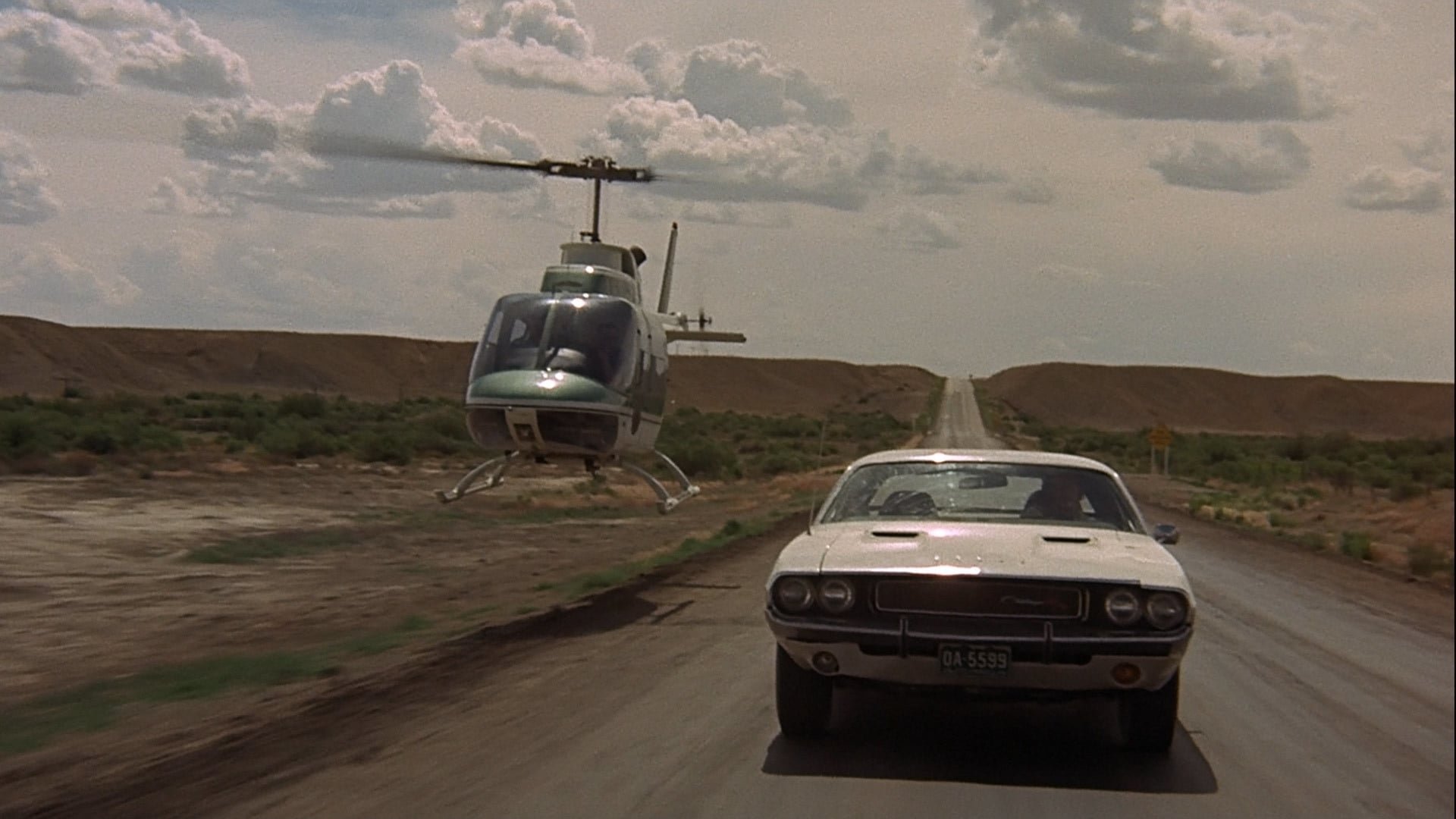 Cinematic background from Vanishing Point 1971 - Kowalski works for a car delivery service, and takes delivery of a 1970 Dodge Challenger to drive from Colorado to San Francisco. Shortly after pickup, he takes a bet to get the car there in less than 15 hours.
