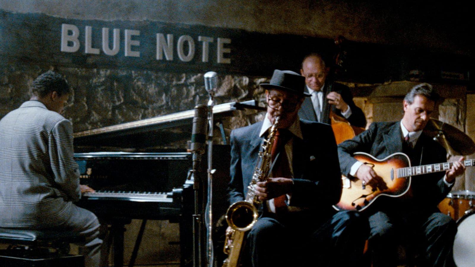 Cinematic background from 'Round Midnight 1986 - Inside the Blue Note nightclub one night in 1959 Paris, an aged, ailing jazzman coaxes an eloquent wail from his tenor sax. Outside, a young Parisian too broke to buy a glass of wine strains to hear those notes. Soon they will form a friendship that sparks a final burst of genius.