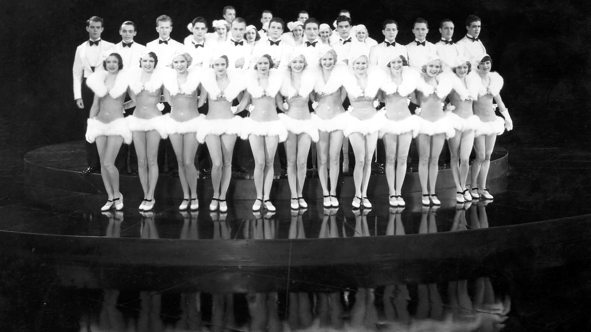 Cinematic background from 42nd Street 1933 - A producer puts on what may be his last Broadway show, and at the last moment a chorus girl has to replace the star.