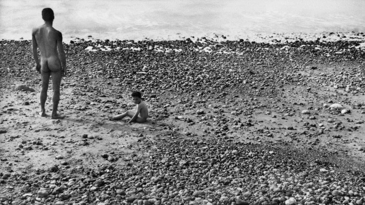 Cinematic background from Ulysse 1983 - At the sea shore, a goat, a child, and a naked man. This is a photograph taken in 1954 by Agnès Varda. The goat was dead, the child was named Ulysses, and the man was naked. Starting from this frozen image, the film explores the real and the imaginary.