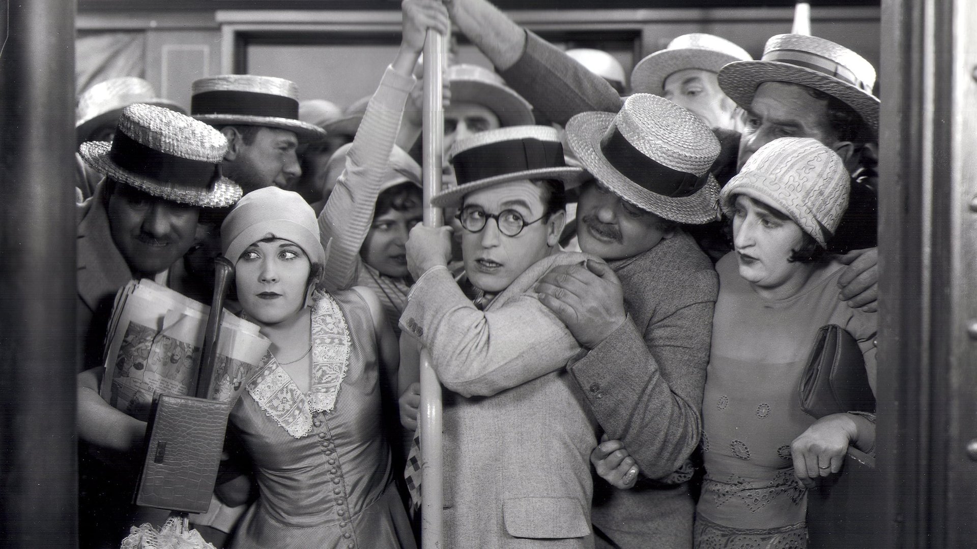 Cinematic background from Speedy 1928 - Speedy loses his job as a soda jerk, then spends the day with his girl at Coney Island. He then becomes a cab driver and delivers Babe Ruth to Yankee Stadium, where he stays to see the game. When the railroad tries to run the last horse-drawn trolley (operated by his girl's grandfather) out of business, Speedy organizes the neighborhood old-timers to thwart their scheme.