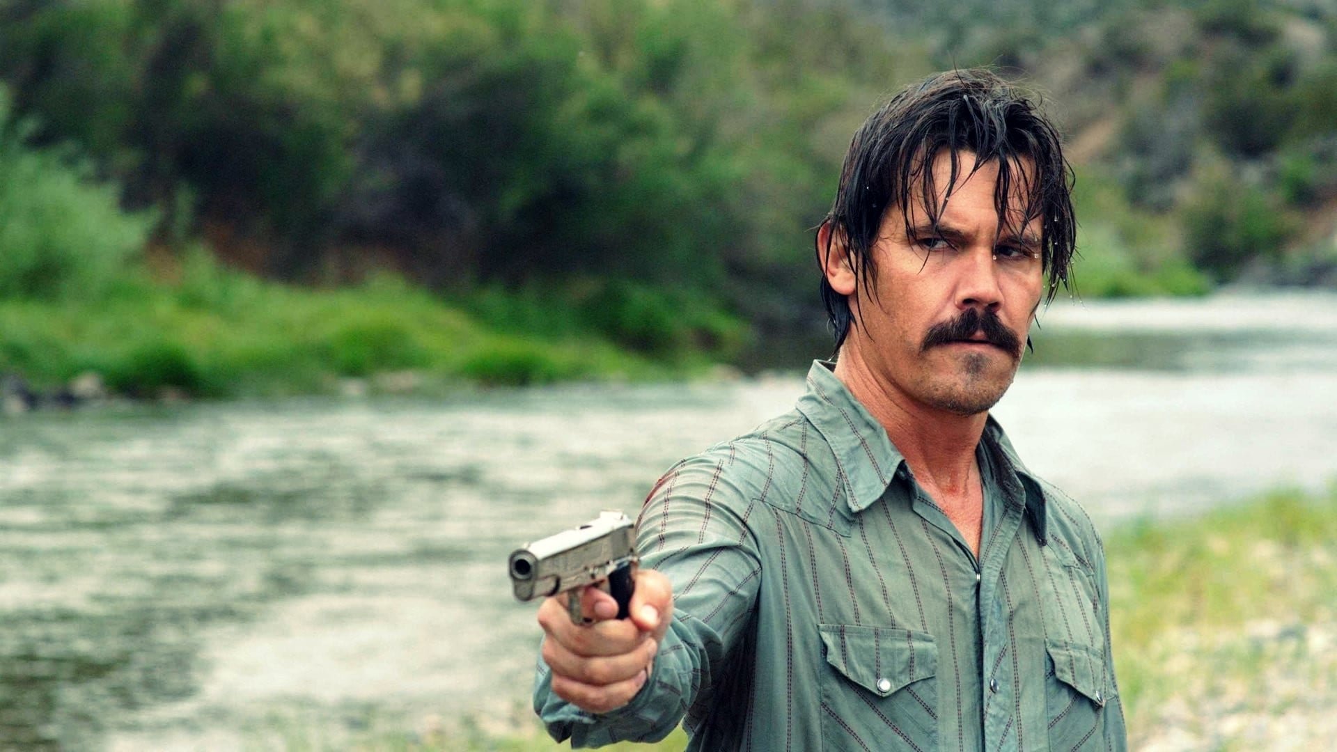 Cinematic background from No Country for Old Men 2007 - Llewelyn Moss stumbles upon dead bodies, $2 million and a hoard of heroin in a Texas desert, but methodical killer Anton Chigurh comes looking for it, with local sheriff Ed Tom Bell hot on his trail. The roles of prey and predator blur as the violent pursuit of money and justice collide.