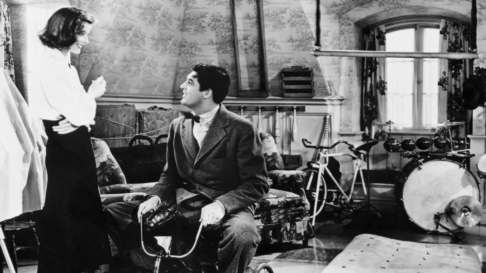 Cinematic background from Holiday 1938 - Johnny Case, a freethinking financier, has finally found the girl of his dreams — Julia Seton, the spoiled daughter of a socially prominent millionaire — and she's agreed to marry him. But when Johnny plans a holiday for the two to enjoy life while they are still young, his fiancée has other plans & that is for Johnny to work in her father's bank!