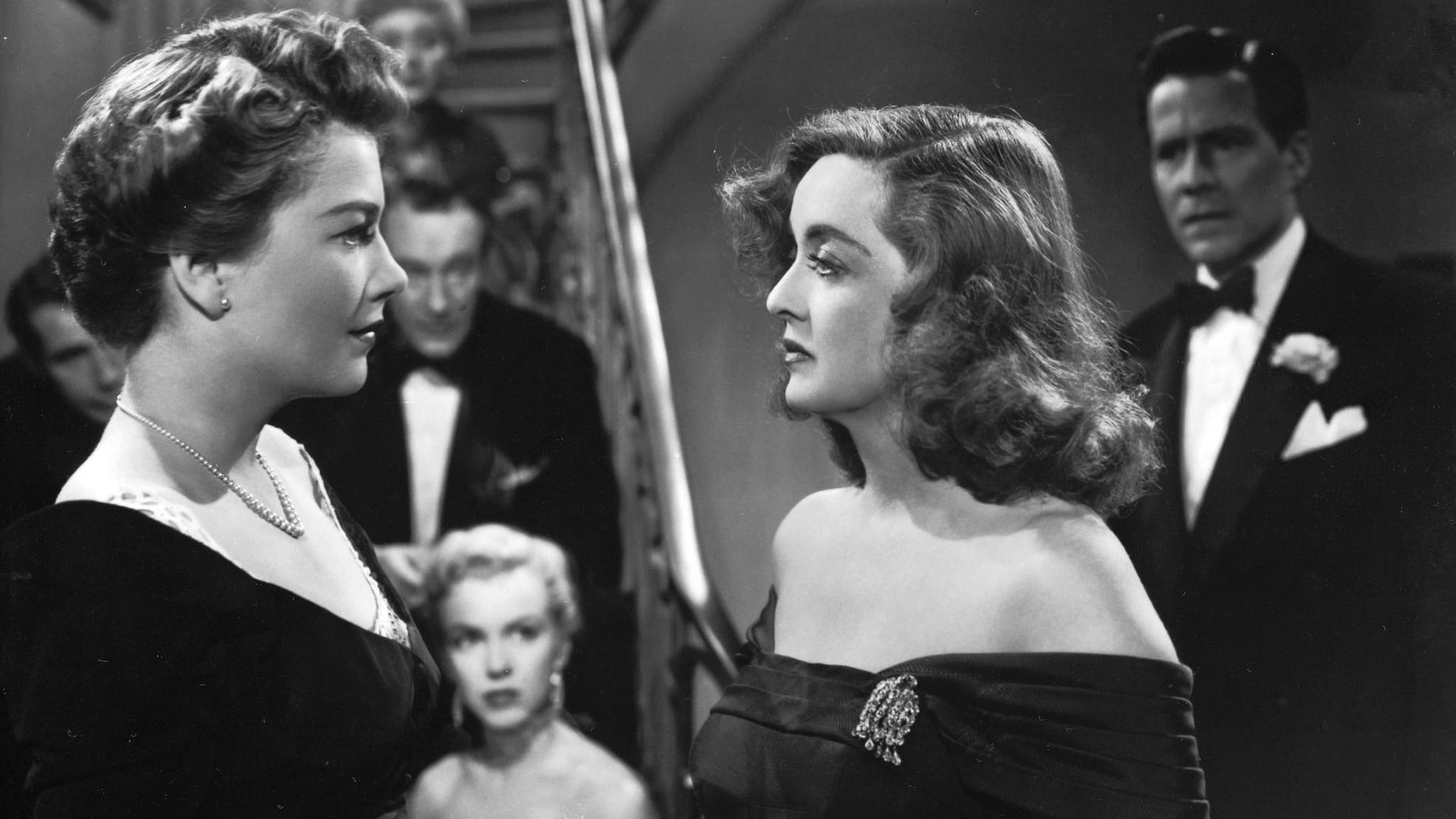 Cinematic background from All About Eve 1950 - From the moment she glimpses her idol at the stage door, Eve Harrington is determined to take the reins of power away from the great actress Margo Channing. Eve maneuvers her way into Margo's Broadway role, becomes a sensation and even causes turmoil in the lives of Margo's director boyfriend, her playwright and his wife. Only the cynical drama critic sees through Eve, admiring her audacity and perfect pattern of deceit.