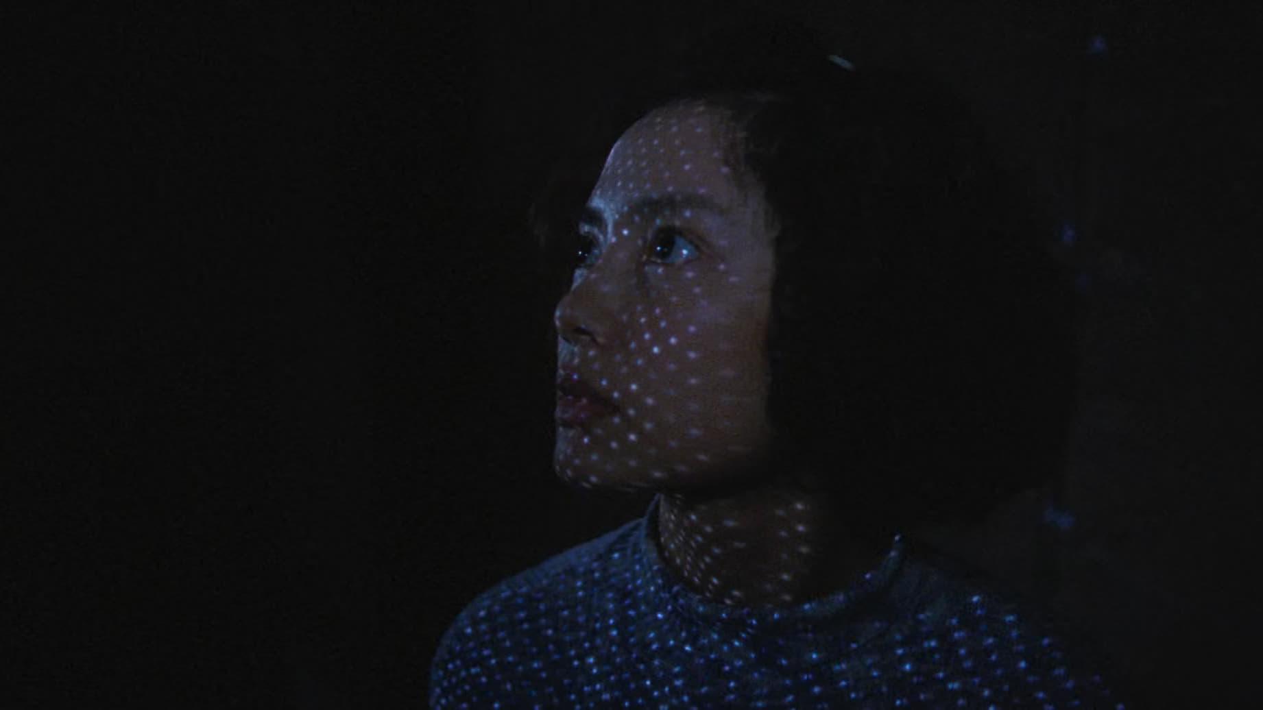 Cinematic background from Goodbye, Dragon Inn 2003 - On a dark and rainy night, a historic and regal Taipei cinema sees its final film: 1967 martial arts feature "Dragon Inn". As the film plays, the lives of the theater's various employees and patrons intersect, and two ghostly actors arrive to mourn the passing of an era.