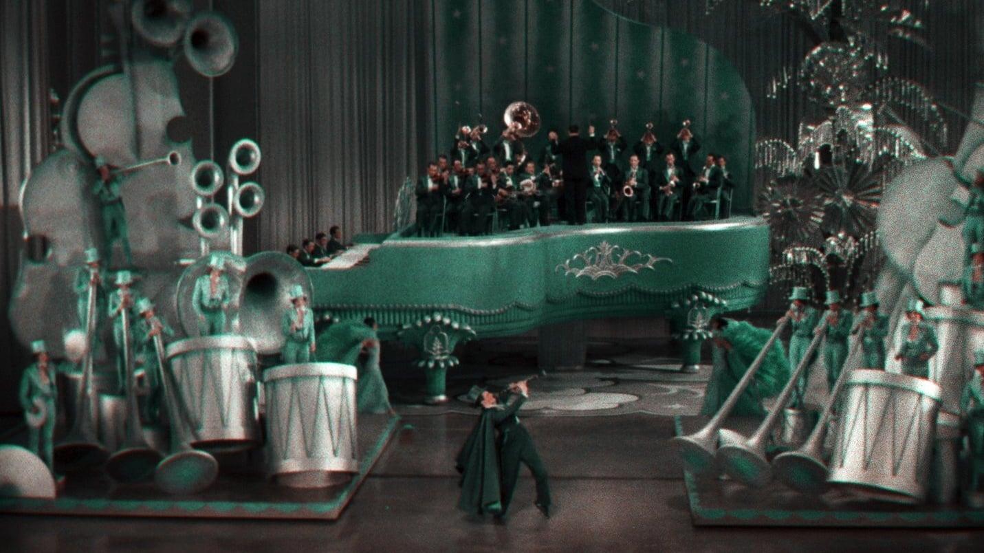 Cinematic background from King of Jazz 1930 - Made during the early years of the movie musical, this exuberant revue was one of the most extravagant, eclectic, and technically ambitious Hollywood productions of its day. Starring the bandleader Paul Whiteman, then widely celebrated as the King of Jazz, the film drew from Broadway variety shows to present a spectacular array of sketches, performances by such acts as the Rhythm Boys (featuring a young Bing Crosby), and orchestral numbers—all lavishly staged by veteran theater director John Murray Anderson.