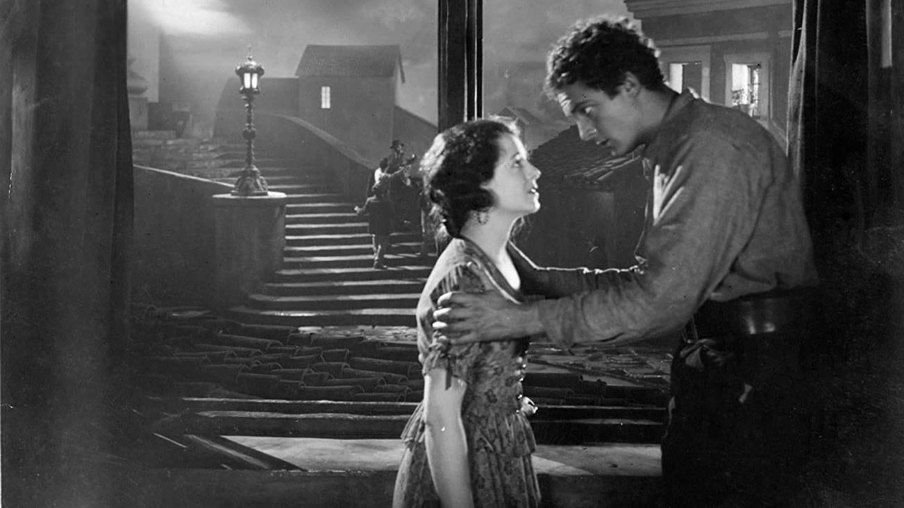 Cinematic background from Street Angel 1928 - A spirited young woman finds herself destitute and on the streets before joining a traveling carnival, where she meets a vagabond painter.