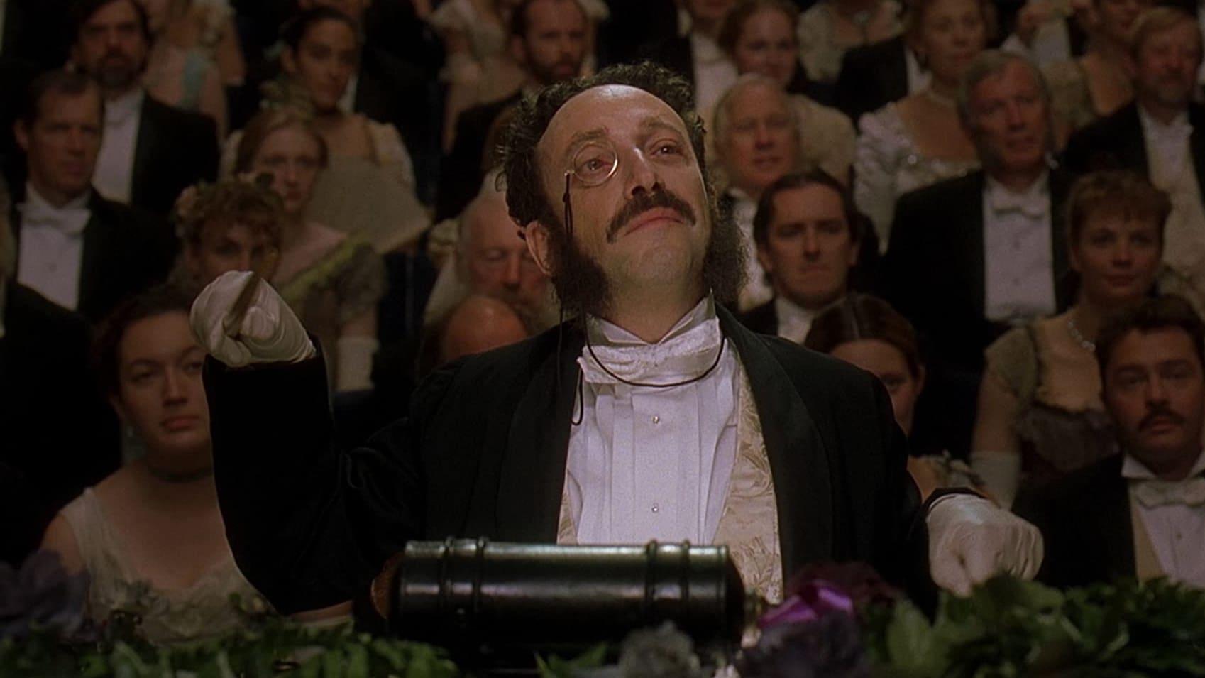 Cinematic background from Topsy-Turvy 1999 - After their production "Princess Ida" meets with less-than-stunning reviews, the relationship between Gilbert and Sullivan is strained to breaking. Their friends and associates attempt to get the two to work together again, which opens the way to "The Mikado," one of the duo's greatest successes.