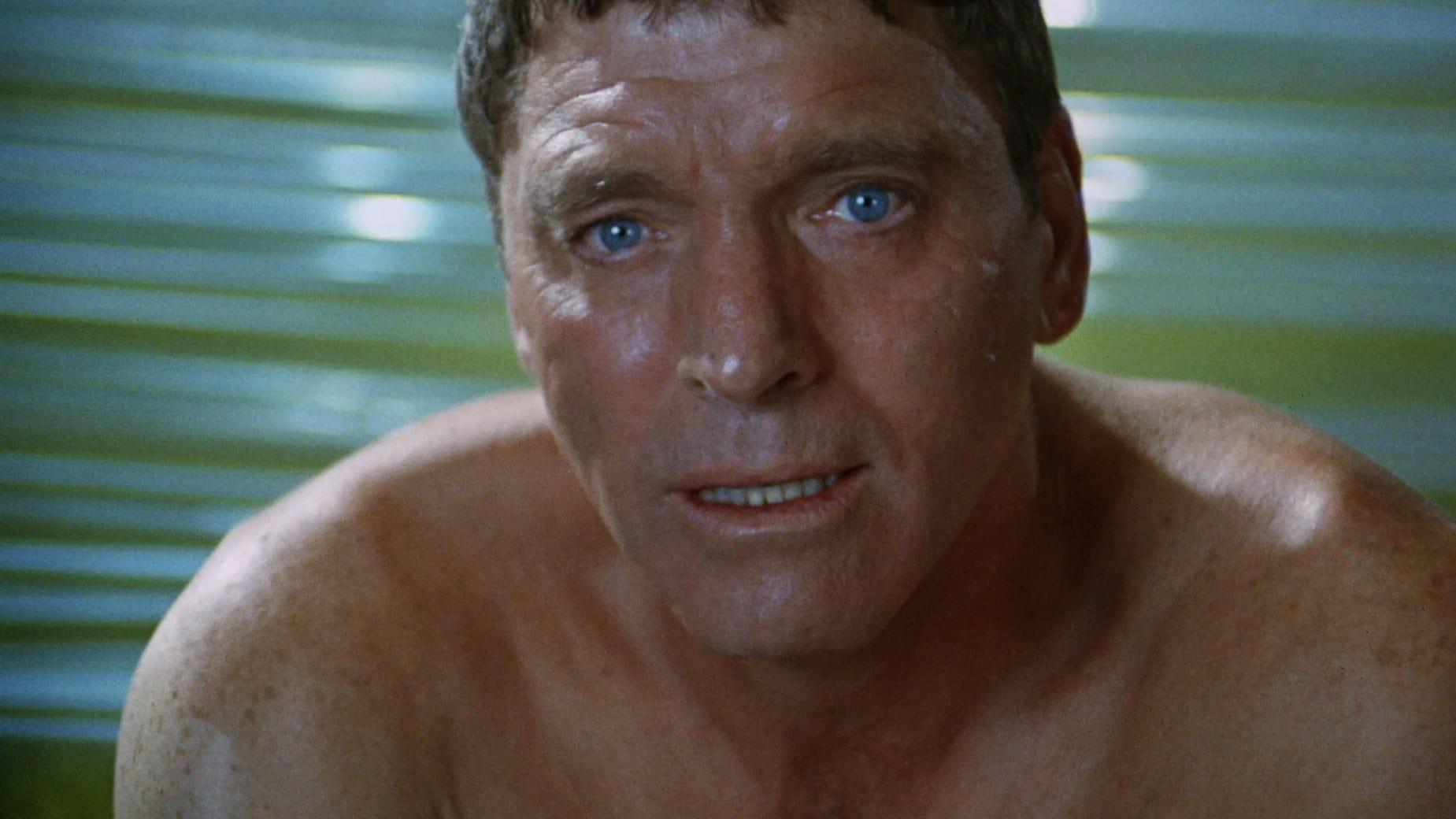 Cinematic background from The Swimmer 1968 - Well-off ad man Ned Merrill is visiting a friend when he notices the abundance of backyard pools that populate their upscale suburb. Ned suddenly decides that he'd like to travel the eight miles back to his own home by simply swimming across every pool in town. Soon, Ned's journey becomes harrowing; at each house, he is somehow confronted with a reminder of his romantic, domestic and economic failures.