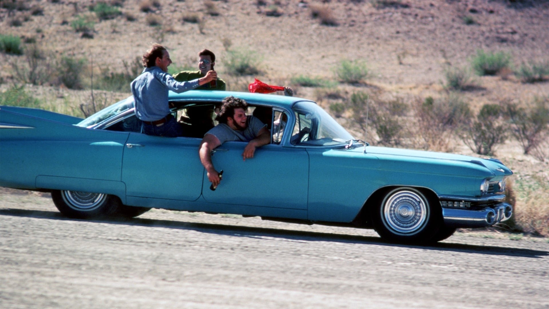 Cinematic background from Fandango 1985 - Five college buddies from the University of Texas circa 1971 embark on a final road trip odyssey across the Mexican border before facing up to uncertain futures, in Vietnam and otherwise.
