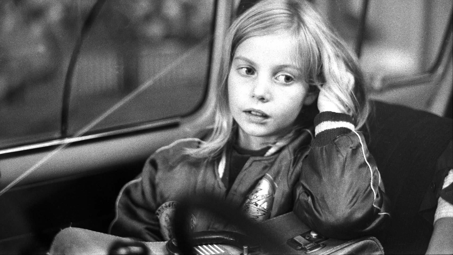 Cinematic background from Alice in the Cities 1974 - German journalist Philip Winter has a case of writer’s block when trying to write an article about the United States. He decides to return to Germany, and while trying to book a flight, encounters a German woman and her nine year old daughter Alice doing the same. The three become friends (almost out of necessity) and while the mother asks Winter to mind Alice temporarily, it quickly becomes apparent that Alice will be his responsibility for longer than he expected.