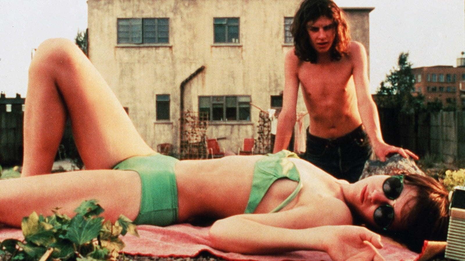 Cinematic background from The Cement Garden 1993 - After the death of her husband, the mother of Julie, Jack, Sue and Tom begins to suffer from a mysterious illness. Aware that she is going to have to go into hospital she opens a bank account for the children, so that they can be financially self-sufficient and will be able to avoid being taken into care by the authorities. Unfortunately she also dies and Julie and Jack (the older, teenage children) decide to hide her body in the basement so that they can have free reign of their household. Soon Tom has taken to dressing as a girl whilst Sue has become increasingly reticent, confiding only to her diary, meanwhile Jack and Julie sense an attraction developing for each other. However Julie's new beau, Derek, threatens to unearth the many dark secrets within this family as he becomes increasingly suspicious of Jack.