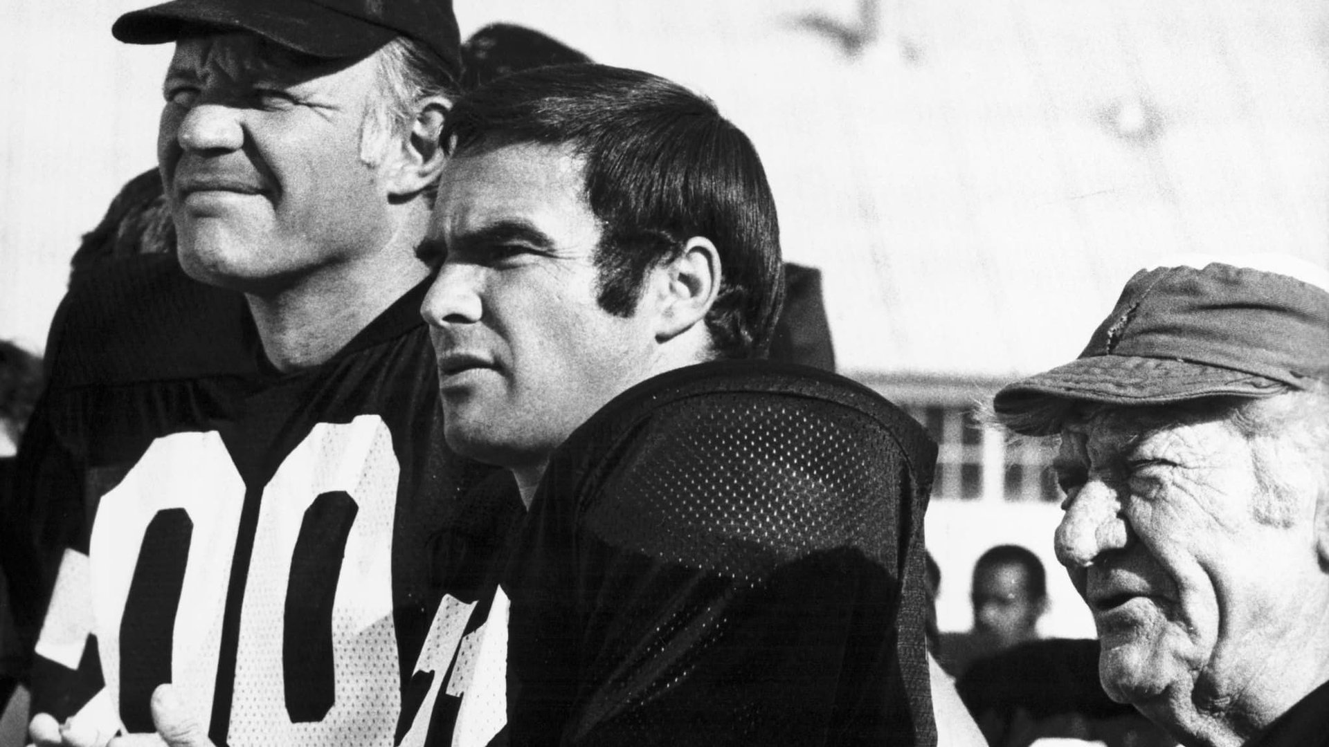 Cinematic background from The Longest Yard 1974 - A football player-turned-convict organizes a team of inmates to play against a team of prison guards. His dilemma is that the warden asks him to throw the game in return for an early release, but he is also concerned about the inmates' lack of self-esteem.