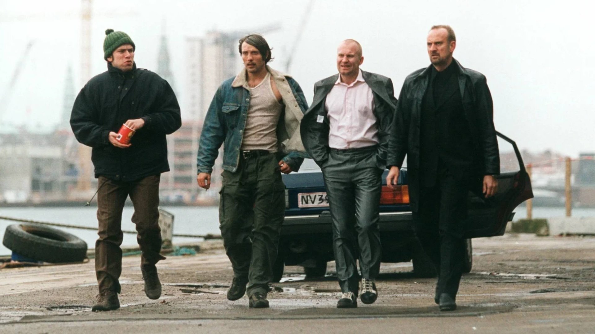 Cinematic background from Flickering Lights 2000 - Four small gangsters from Copenhagen trick a gangster boss: they take over 4,000,000 kroner which they were supposed to bring him. Trying to escape to Barcelona they are forced to stop in the countryside, in an old, wrecked house, hiding there for several weeks. Slowly, one after another, they realize, that they would like to stay there, start a new life.