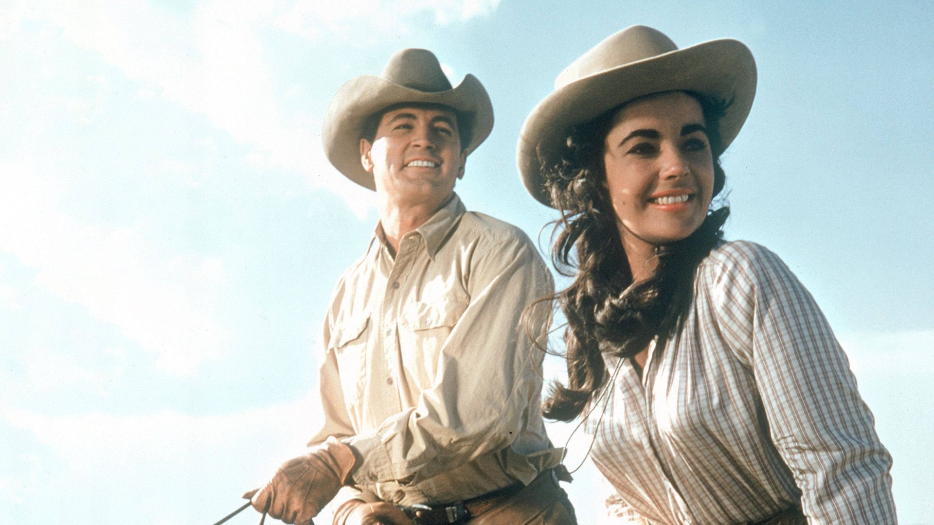 Cinematic background from Giant 1956 - Wealthy rancher Bick Benedict and dirt-poor cowboy Jett Rink both woo Leslie Lynnton, a beautiful young woman from Maryland who is new to Texas. She marries Benedict, but she is shocked by the racial bigotry of the White Texans against the local people of Mexican descent. Rink discovers oil on a small plot of land, and while he uses his vast, new wealth to buy all the land surrounding the Benedict ranch, the Benedict's disagreement over prejudice fuels conflict that runs across generations.